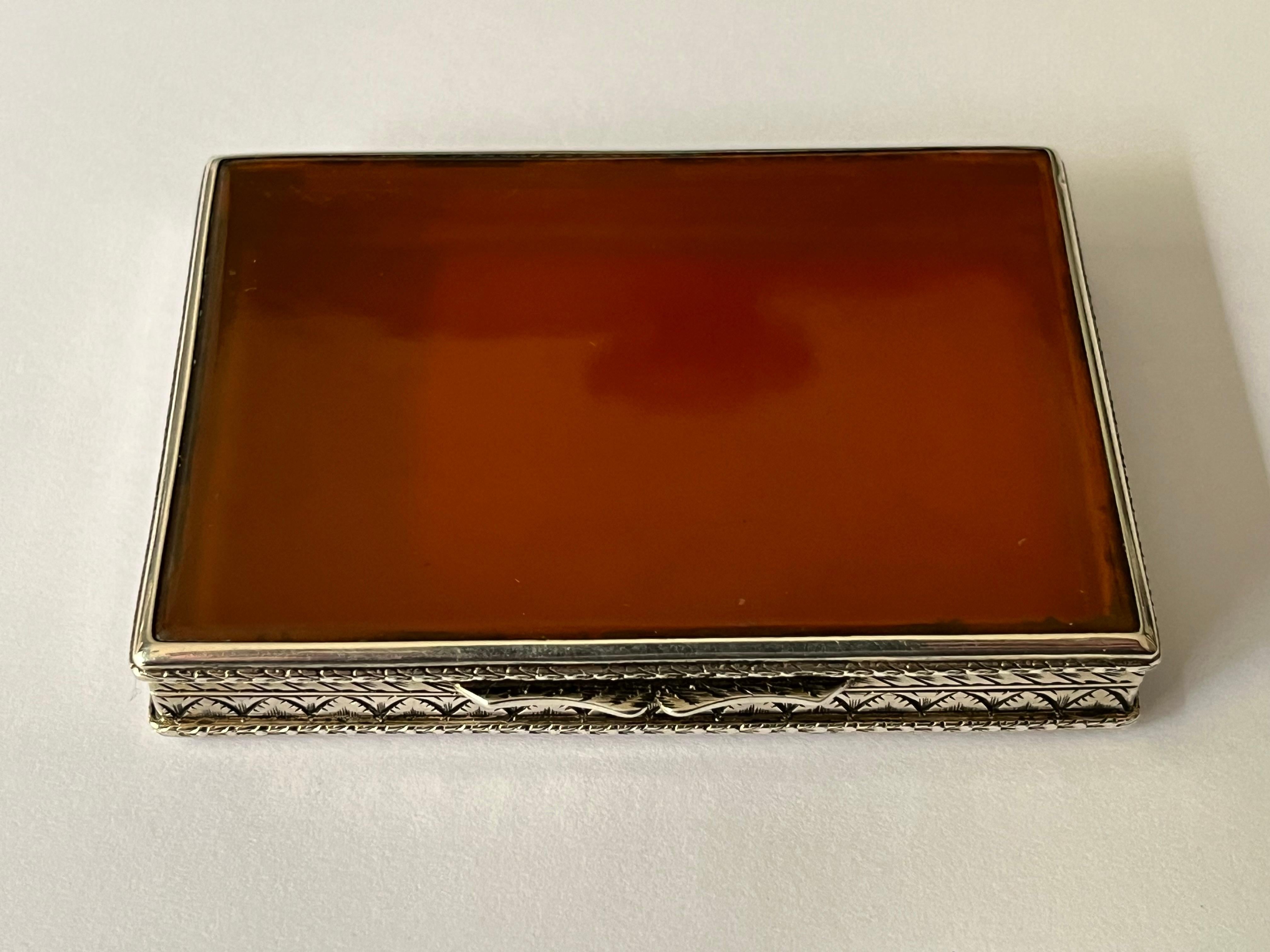 An early twentieth century Italian silver mounted blonde tortoiseshell box, the silver with intricate foliate decoration, the top and bottom cover inset with panels of blonde tortoiseshell. With twin scroll thumbpiece similarly embellished.

 

The
