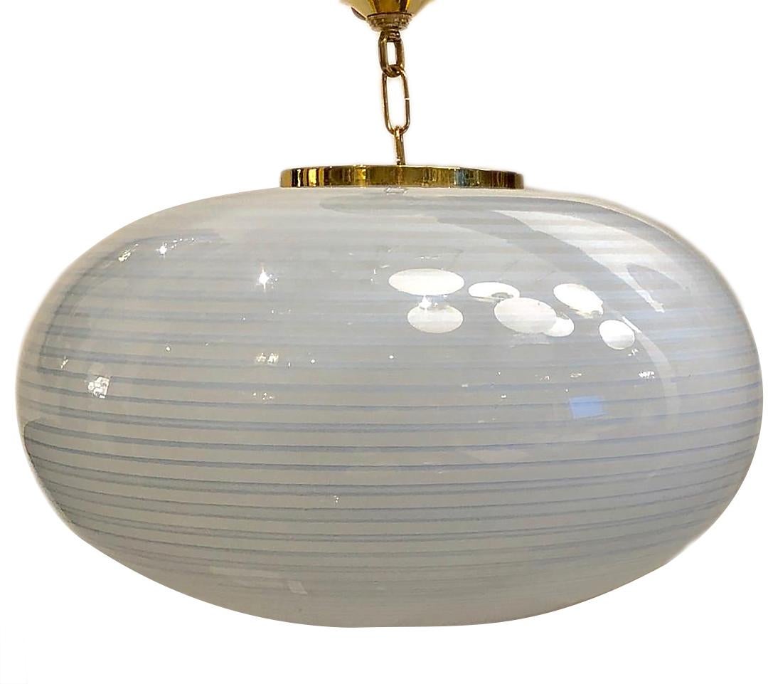 A circa 1960s Italian blown glass light fixture with a blue and white swirling pattern on the body.

Measurements:
Drop 18
