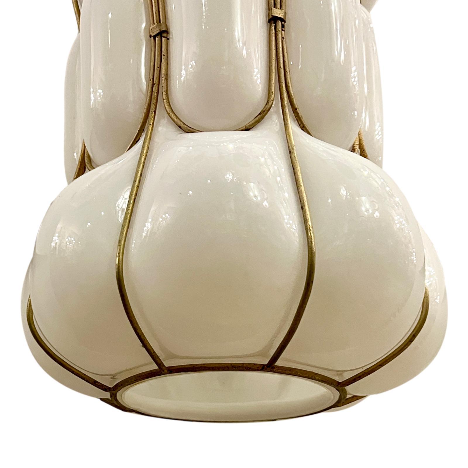 A circa 1960's Italian milk glass blown glass lantern with three interior lights.

Measurements:
Current drop: 28