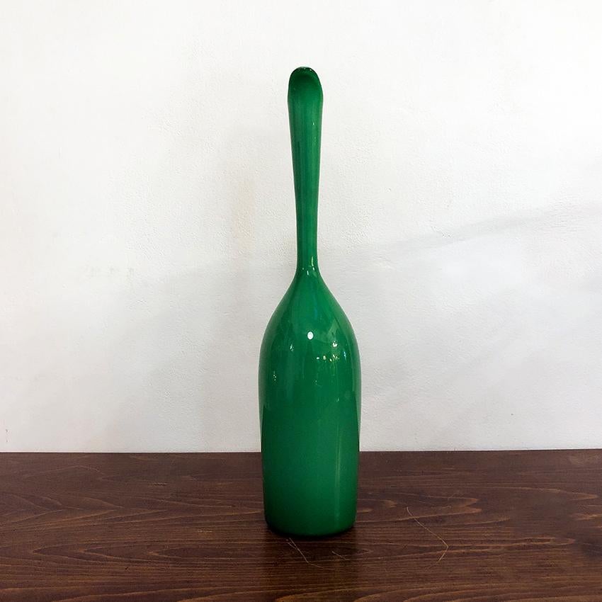 Italian blown Murano glass vase, 1960s.
Emerald green blown Murano glass vase, good condition. A veneer on the glass near the handle.