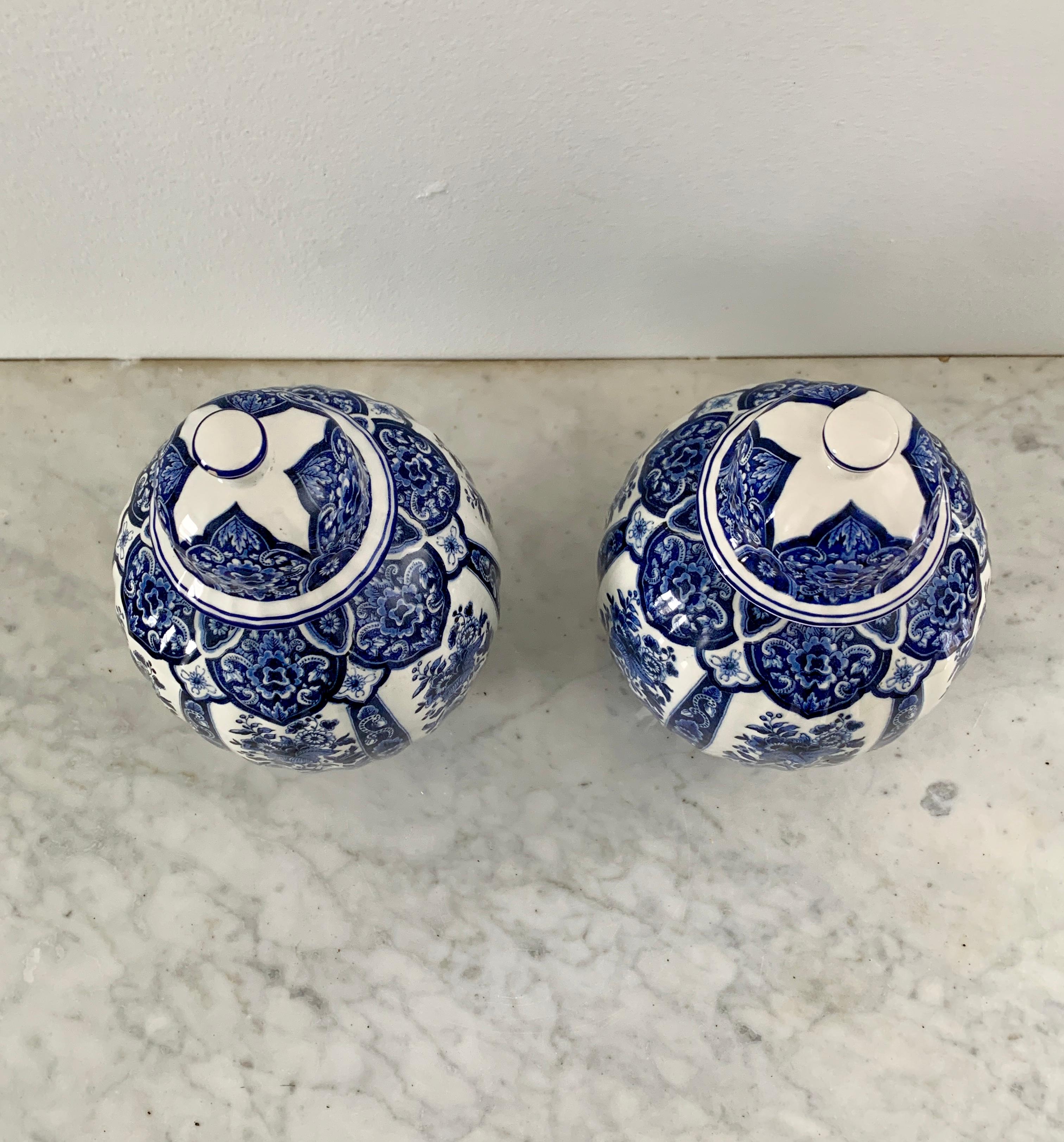 A pair of beautiful Italian blue and white porcelain covered ginger jars or temple jars.

By Ardalt Blue Delfia

Italy, Mid-20th Century

Measures: 5.25