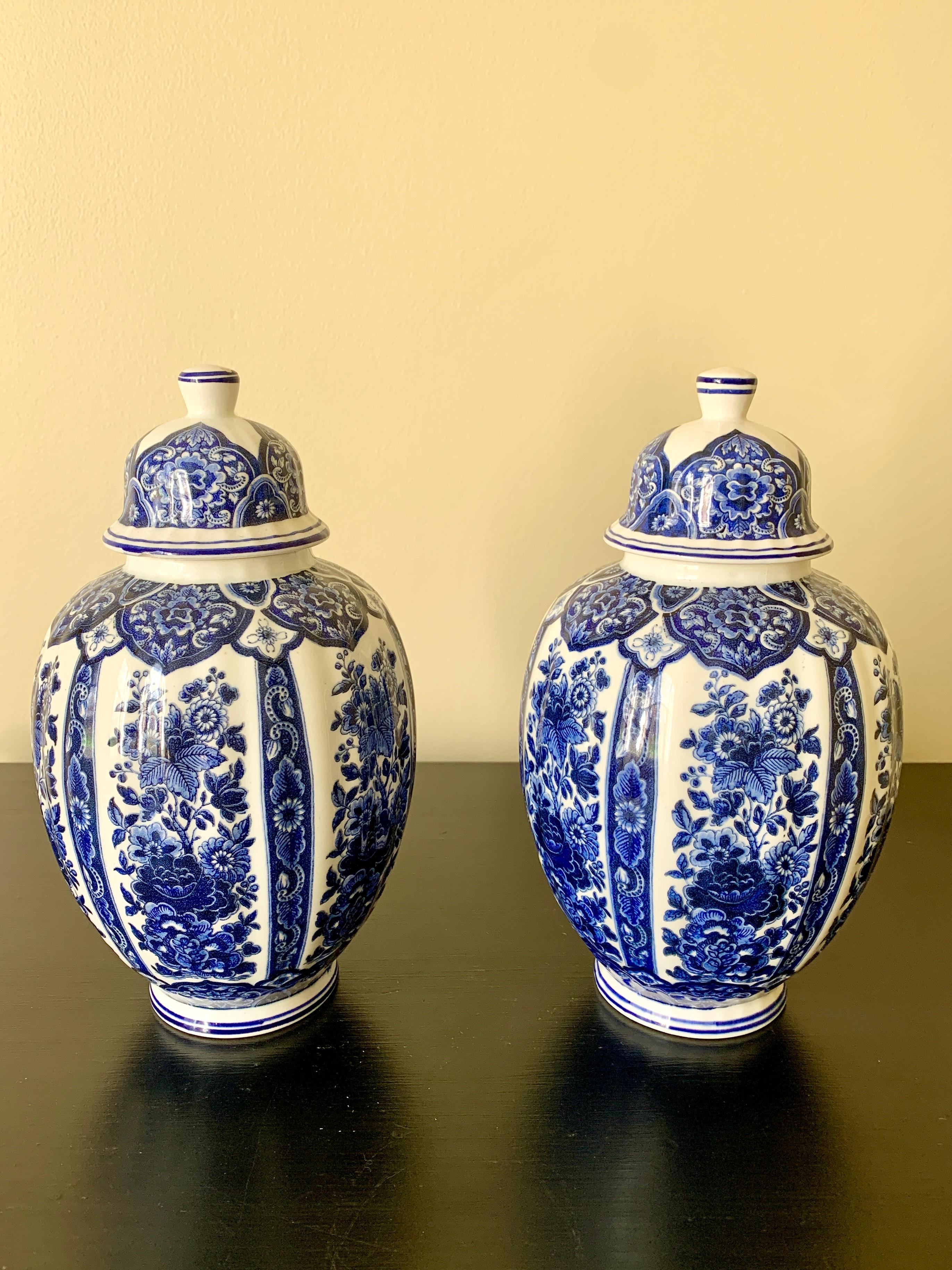 A pair of beautiful Italian blue and white porcelain covered ginger jars

By Ardalt Blue Delfia

Italy, Mid-20th Century

Measures: 5.25ʺW × 5.25ʺD × 9.5ʺH.

Good vintage condition. Minor wear including small chips to one lid and small repaired