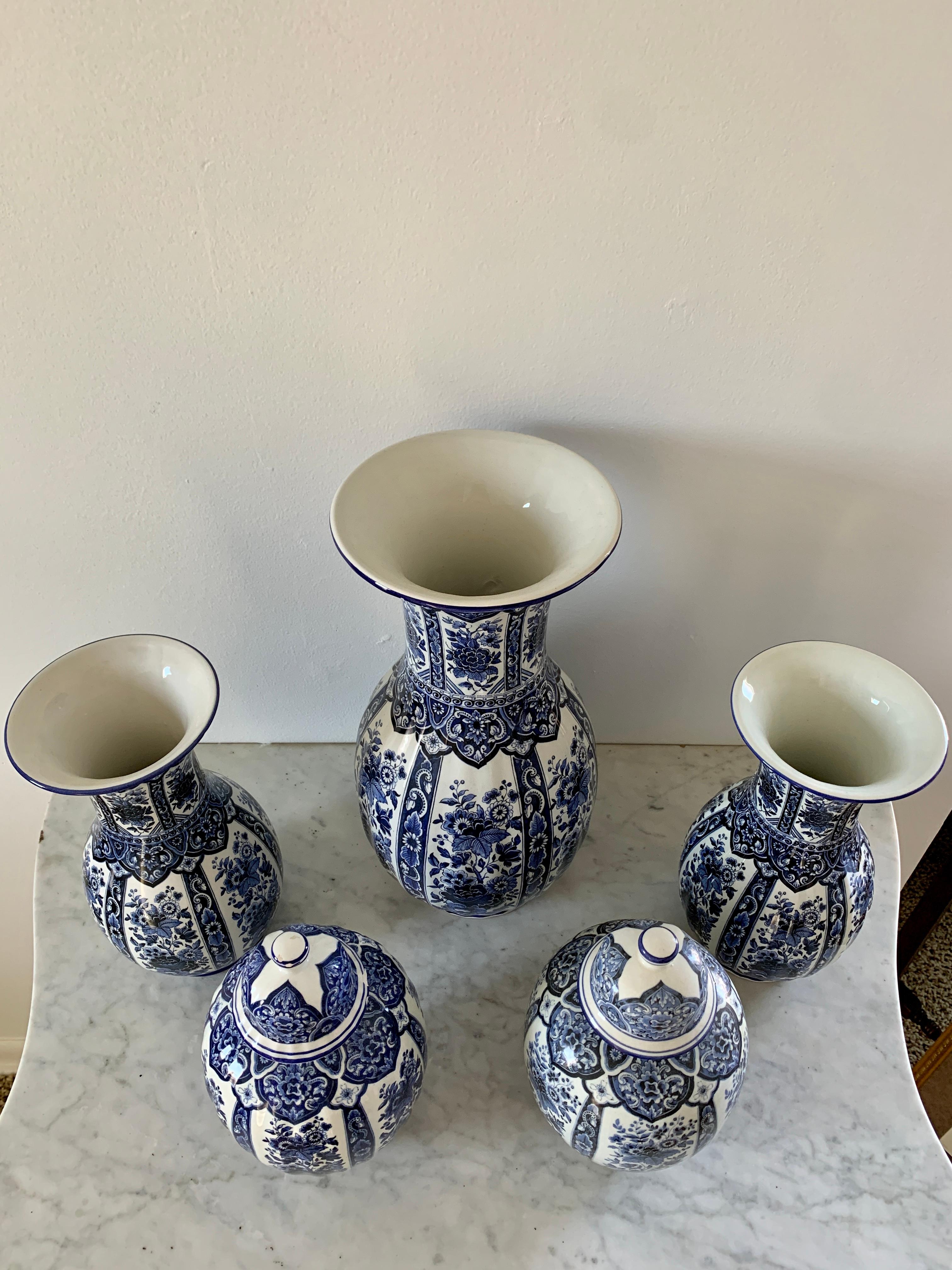 A wonderful set of beautiful Italian blue and white porcelains, including three vases and two covered jars. An instant collection! 

By Ardalt Blue Delfia

Italy, Mid-20th Century

Large Vase Measures: 7ʺW × 7ʺD × 14.25ʺH
Small Vases Measure: 5.25ʺW