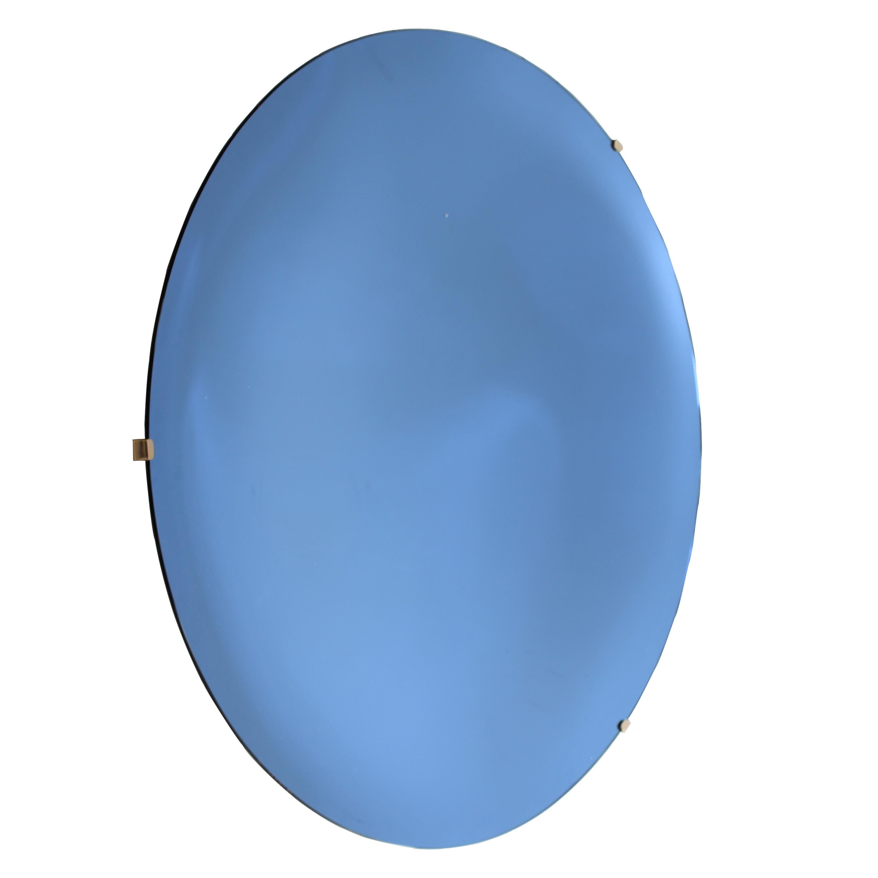 Hand-crafted blue Murano glass concave mirror in a unique size of 130 diameter, with bevel edge and brass back structure for hanging on the wall.