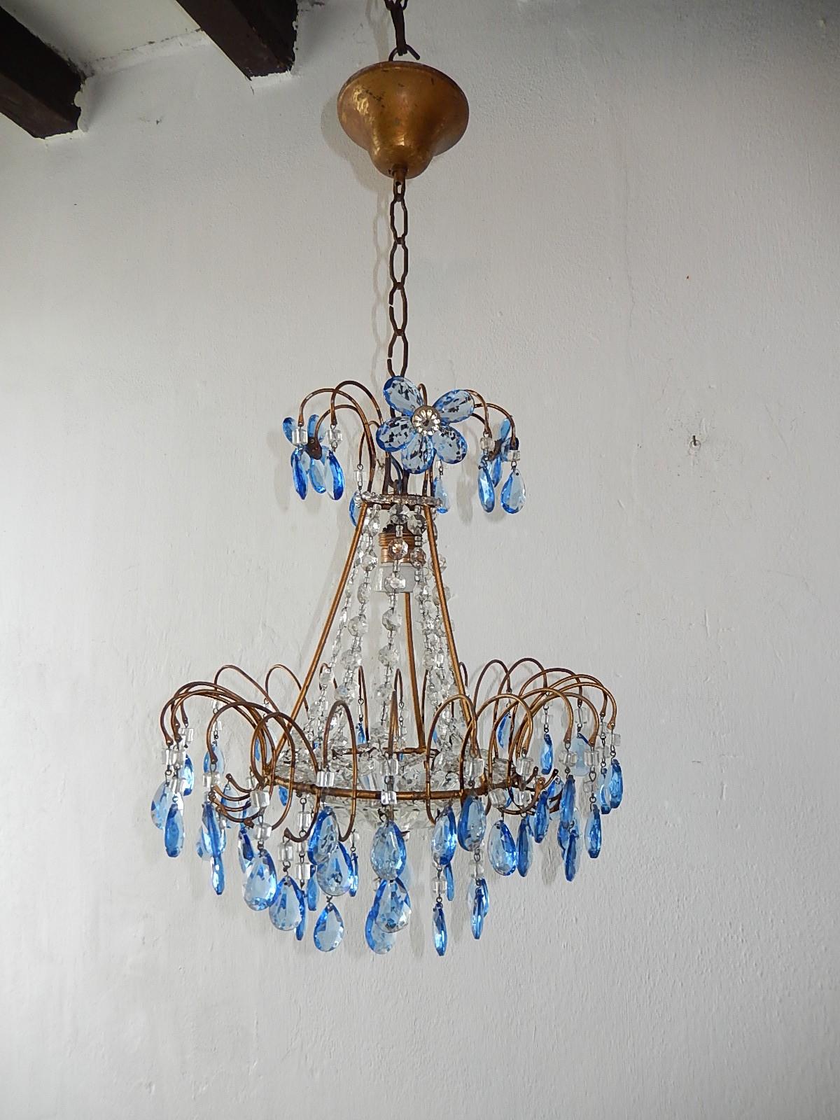 Housing 1 light. Will be re-wired with certified UL US sockets for the United States and appropriate sockets for other countries and ready to hang. Loaded with blue crystal prisms, macaroni beads and Murano glass bottom. Blue flowers on top as well.