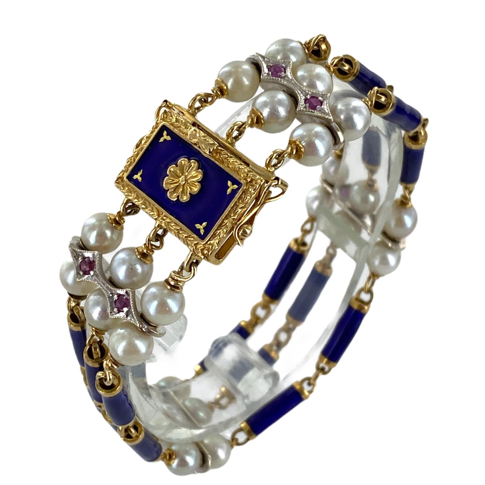 Beautiful Italian blue enamel, cultured pearl, and ruby bracelet fashioned in 18 karat yellow gold. The bracelet, circa 1960's, features three rows of blue enamel links, cultured pearls links set with ruby gemstones, and a blue enamel clasp. The