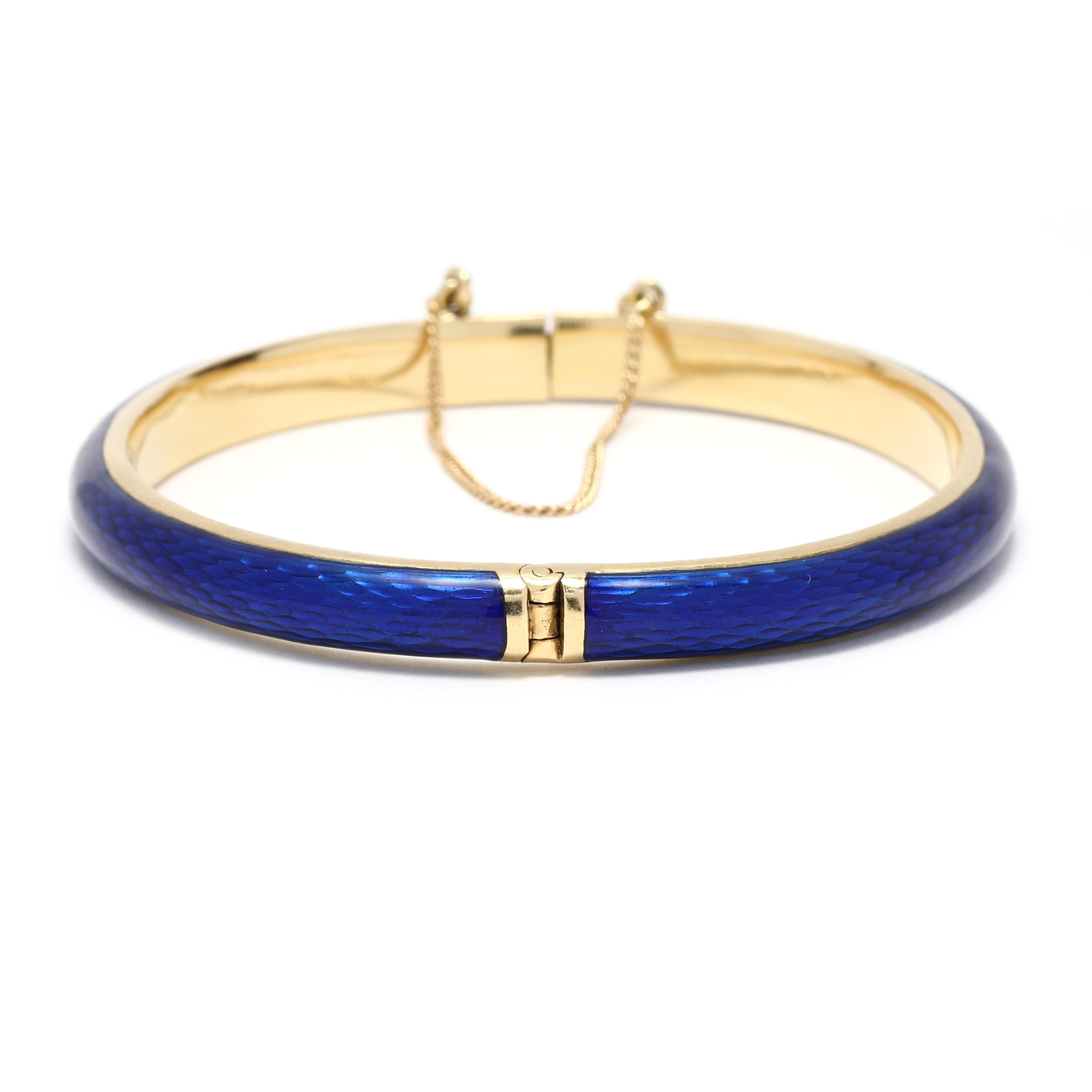 This exquisite Italian Blue Enamel Solid Gold Bangle Bracelet is crafted in 18K Yellow Gold and measures 6.5 inches in length. This elegant bangle bracelet is perfect for everyday wear and makes a great addition to any jewelry collection. This