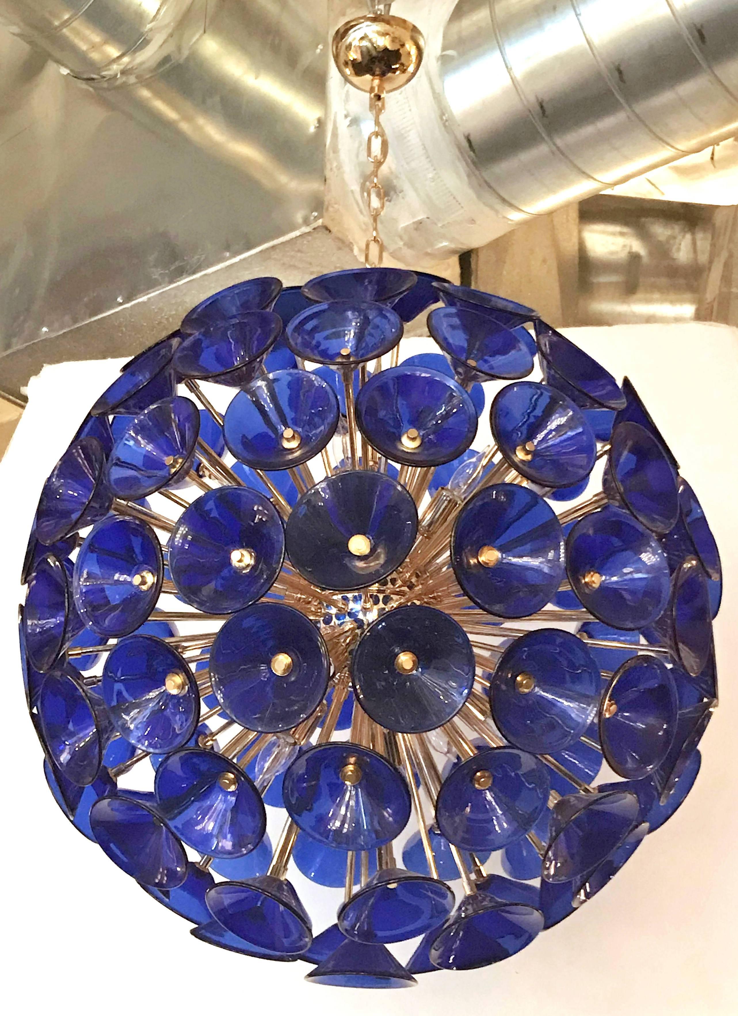 Sputnik chandelier with 105 vintage blue Murano glass trumpets by Vistosi on new 24-karat gold metal finish frame by Fabio Ltd 
12 lights / E12 type / max 40W each
Measures: Diameter 29 inches, height 29 inches
One in stock in Palm Springs.
Order