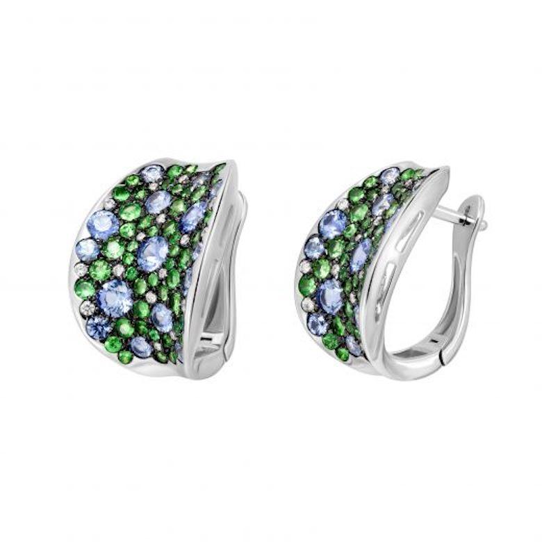 White Gold 14K Earrings 

Diamond 32-RND-57-0,23-4/5
Tsavorite 92-RND-1,98 1/2
Blue Sapphire 30-RND-2,92 Т(5)/2

Weight 11.74 gram

With a heritage of ancient fine Swiss jewelry traditions, NATKINA is a Geneva based jewellery brand, which creates