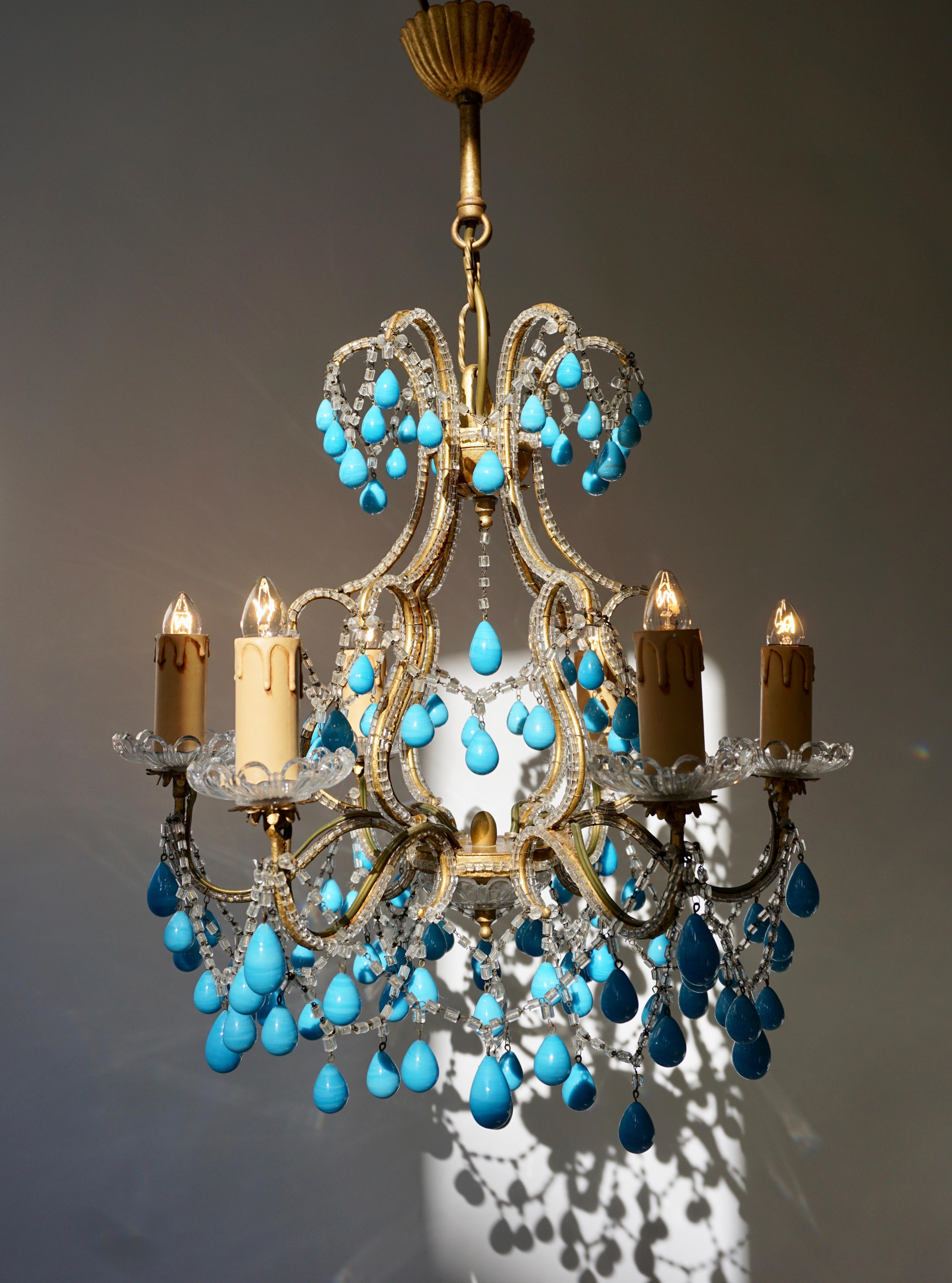 Six-arm chandelier with blue stone drops.
Measures: Diameter 45 cm.
Height fixture 45 cm.
Total height 65 cm.
Six E14 bulbs.
