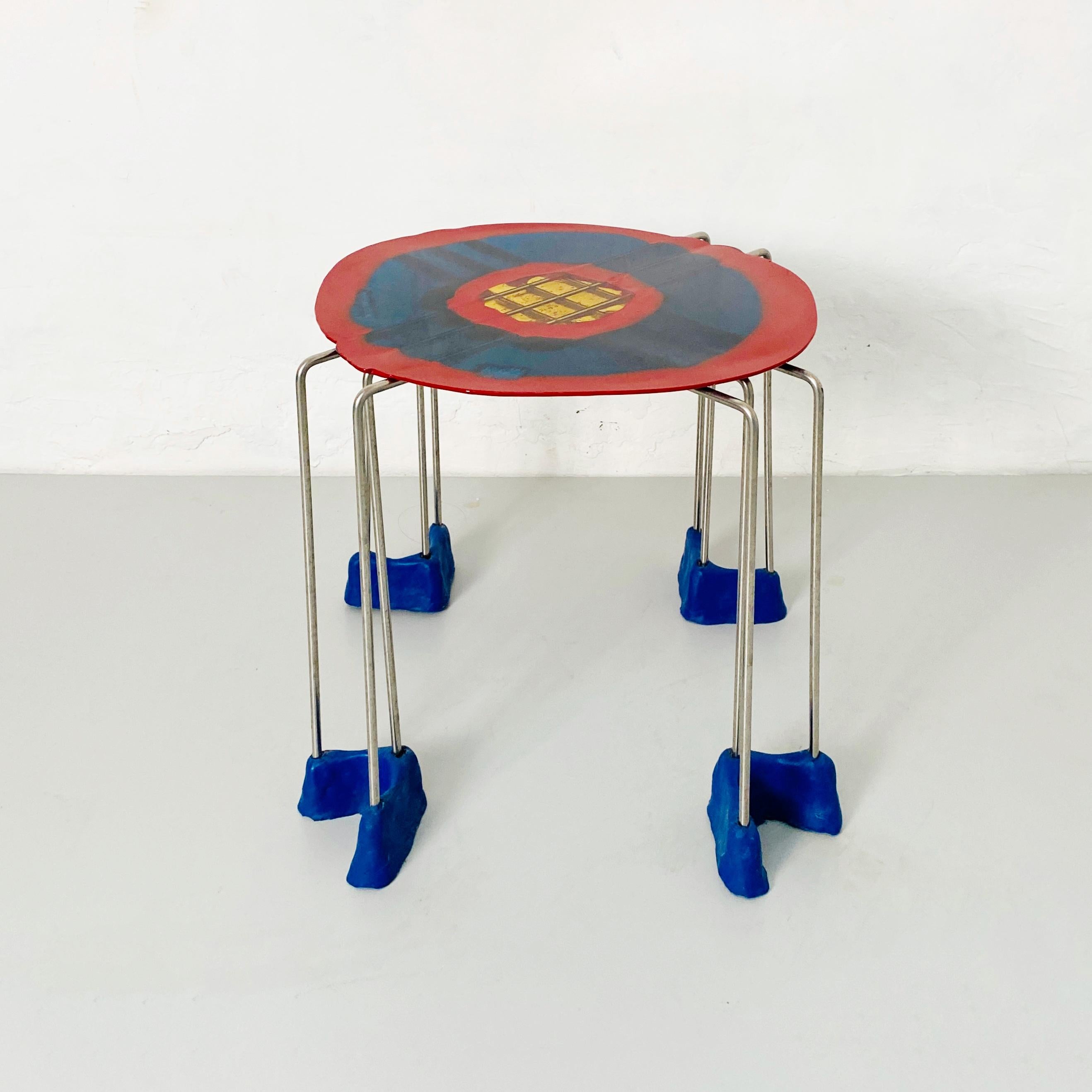 Triple play resin stool by Gaetano Pesce for Fish Design, 2000s
Stool with rigid resin top in red, stainless steel structure and flexible resin feet. 
Made by Fish Design and designed by Getano Pesce.

Good conditions.

Measurements in cm 40 x