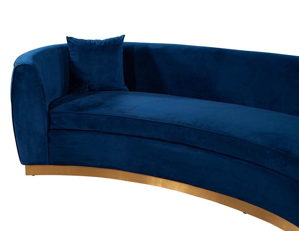 curved blue velvet sofa