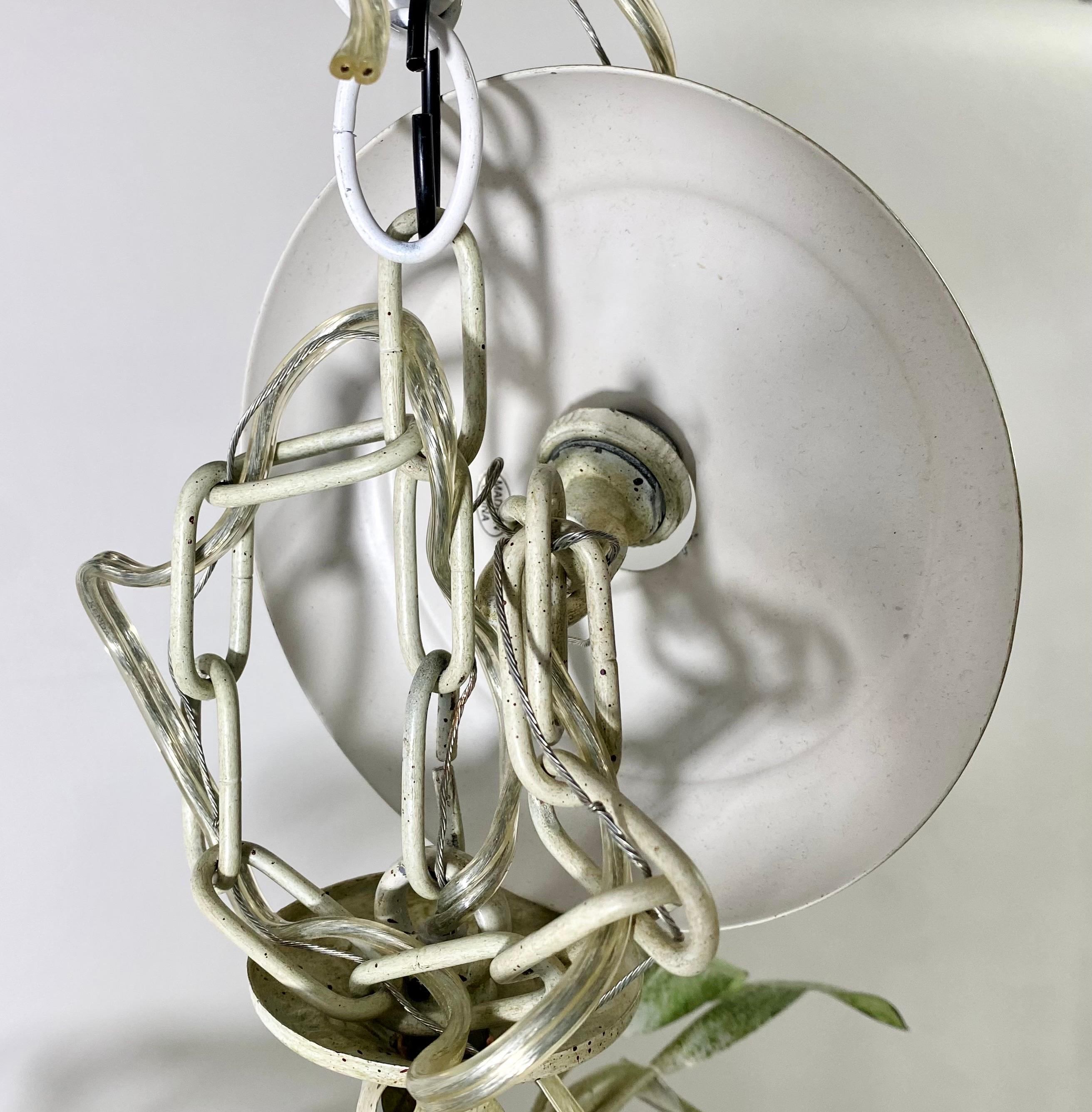 A midcentury 1960s Bohemian Italian tole metal chandelier. This exquisite chandelier features a green leaf design with the bottom displaying 5 blown glass tulip shape lights. The glass tulip shades are beautifully decorated with brown copper colored