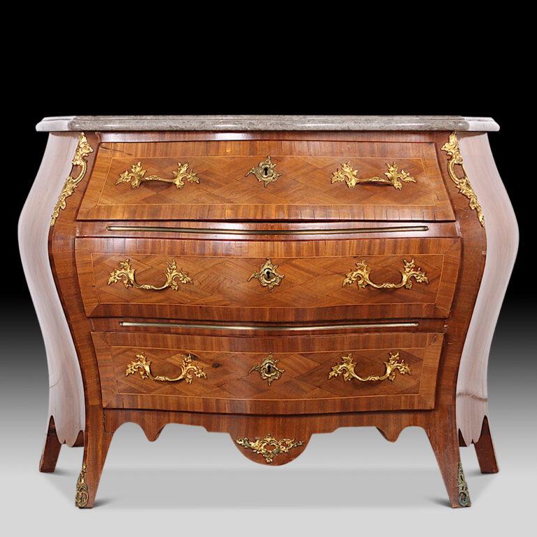 Dramatically-shaped Italian bombe commode with parquet inlay and the original shaped marble top with complex moulded edge. Finely cast and finished gilt bronze mounts. C. 1910 to 1920's.