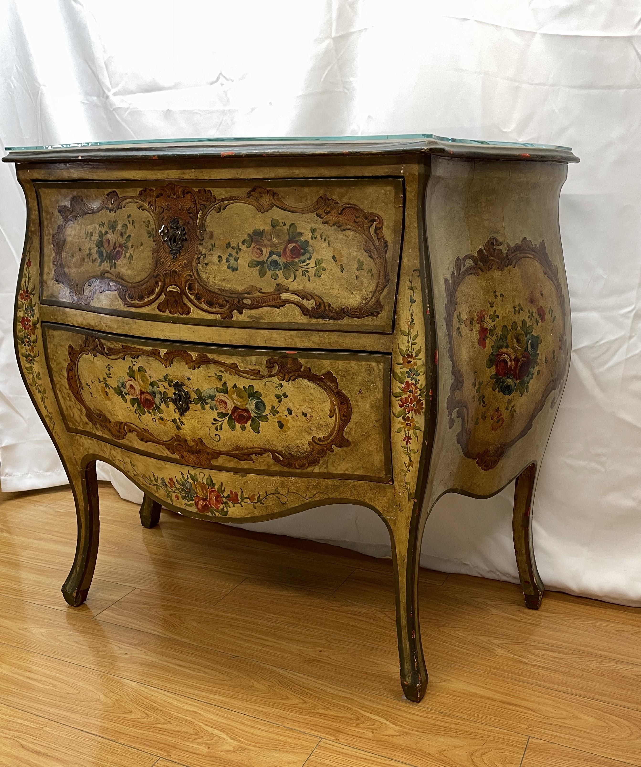 Italian bombe two-drawer commode.

Hand painted with glass top and key lock

42 x 19 x 56