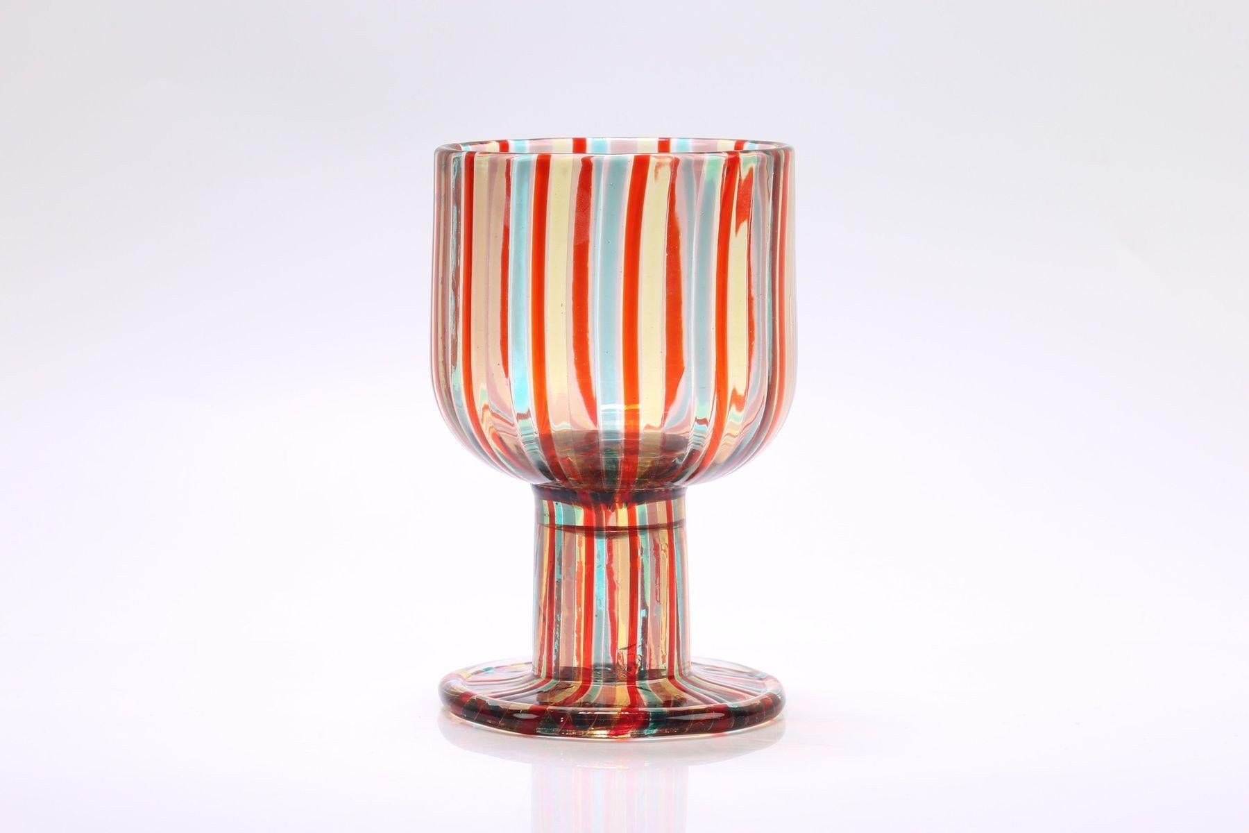 Italian Bonbon Striped Glass Dish/Bowl in red and blue from Murano, 1960s
Crafted with intricate detail, this decorative striped glass bowl is perfect for presenting bonbons or snacks in style. Originating from the artistic hub of Murano, Italy,