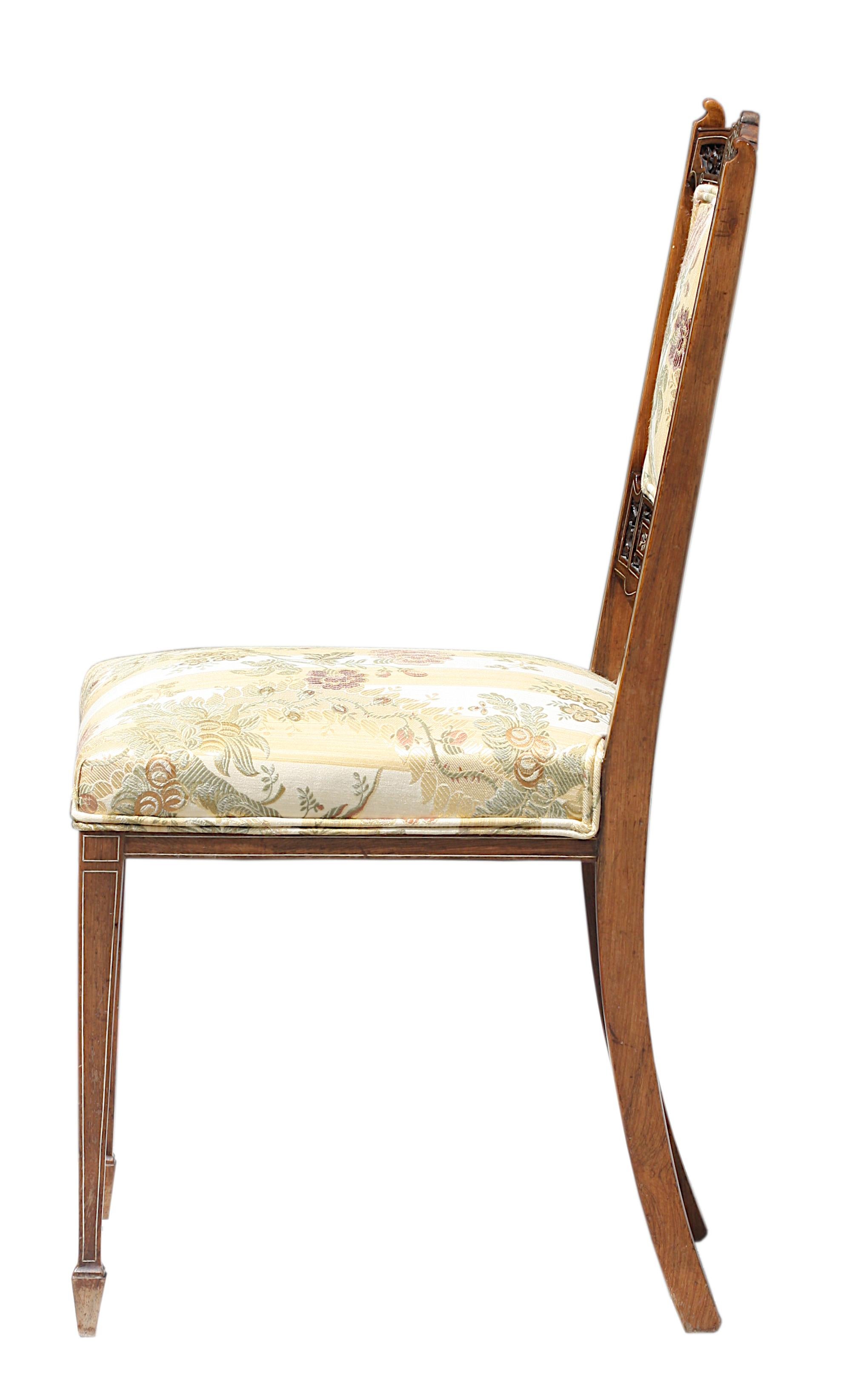 
Italian Bone and Ebony Inlaid Rosewood Side Chair
Circa 1870. The back with a pierced and inlaid crest above a central padded back, the upholstered seat on inlaid square tapering legs. 
Height 35 in. (88.9 cm.), Width 16 in. (40.64 cm.), Depth 17.5