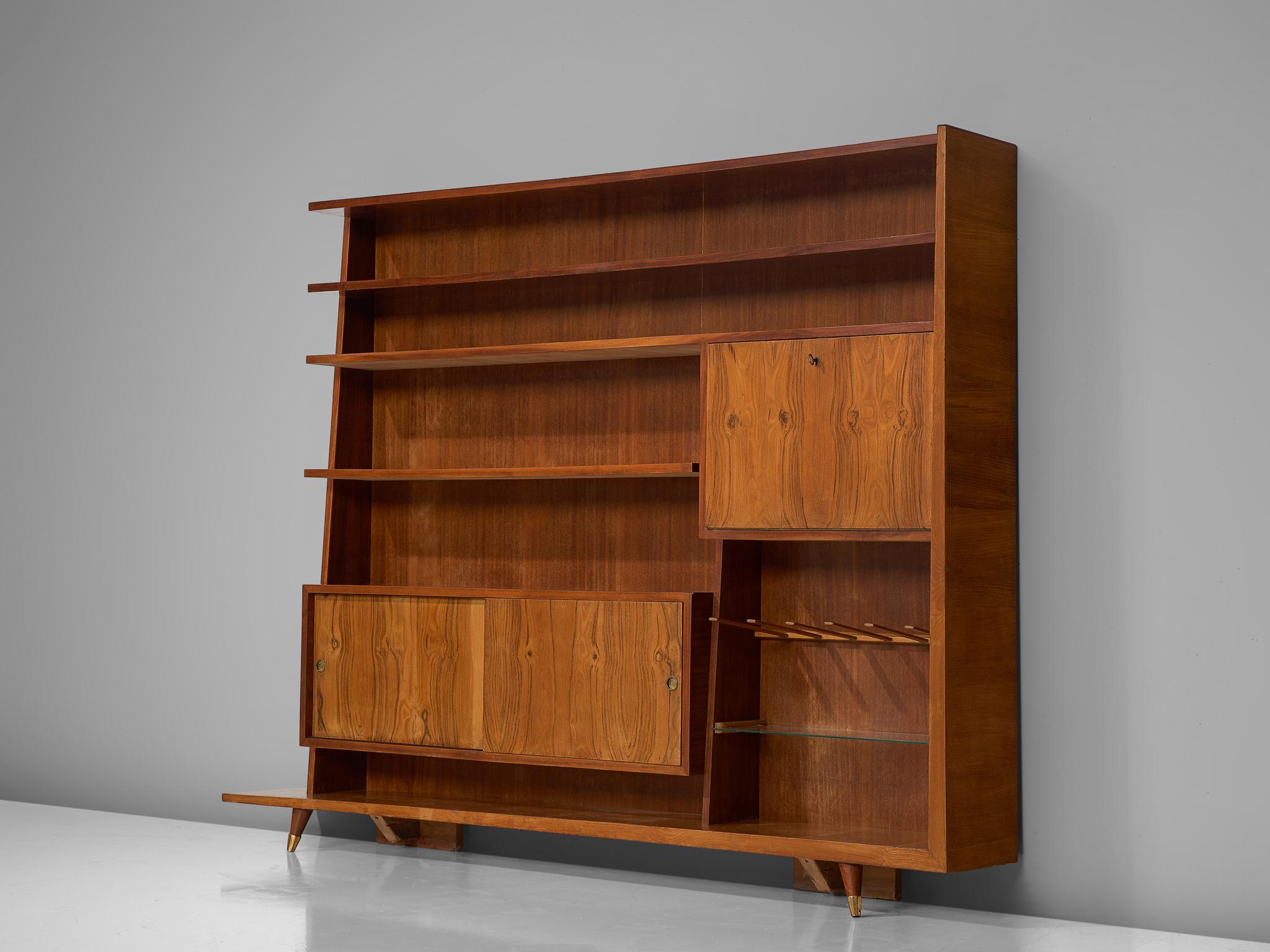 Bookcase, oak, walnut, brass and glass, Italy, circa 1950.

This sophisticated, large bookcase designed in Italy comes in a great size. With a nice variety of storage compartment and shelves, this pieces offers plenty of storage space and options to