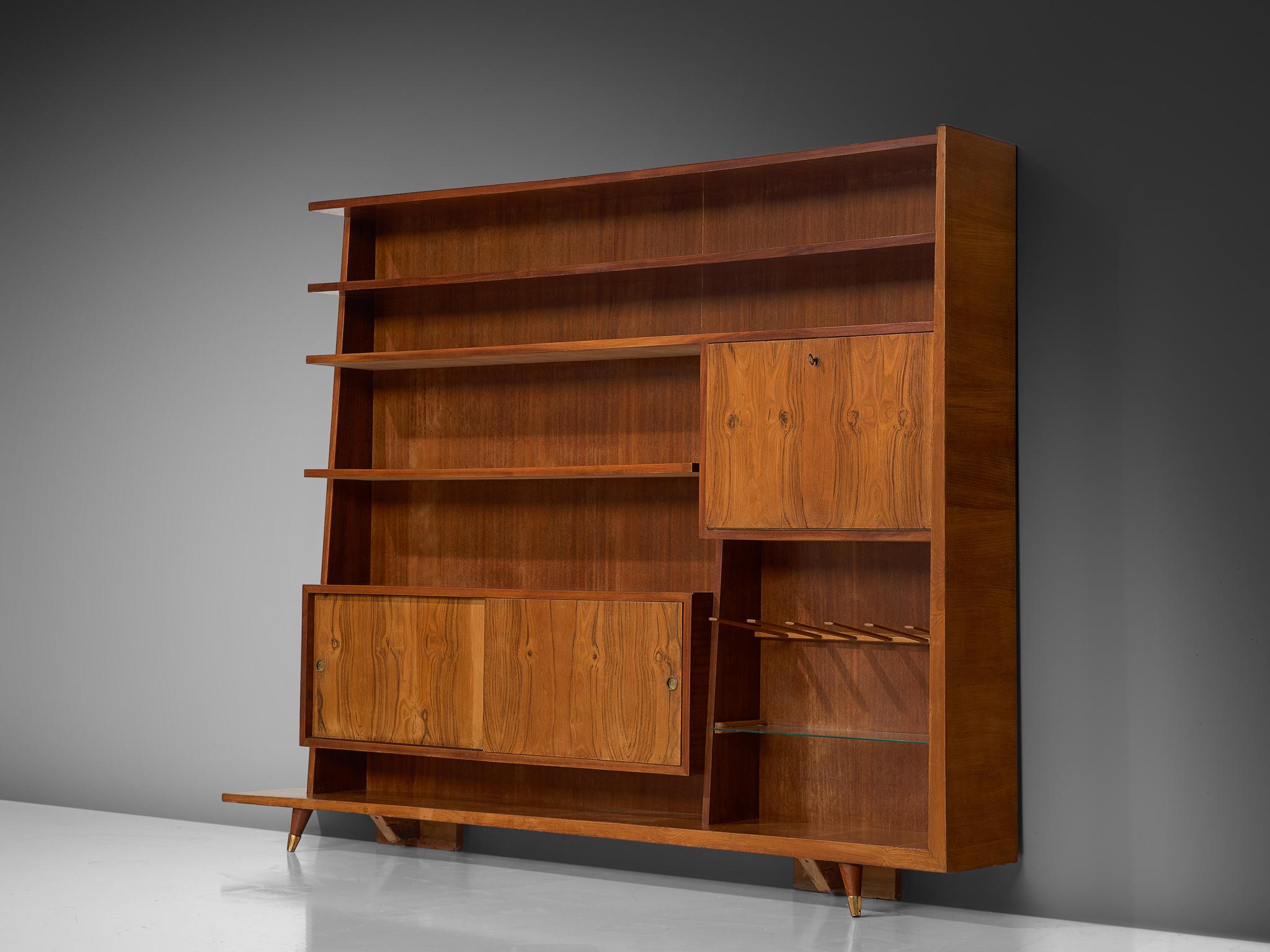Bookcase, oak, walnut, brass and glass, Italy, circa 1950.

This sophisticated, large bookcase designed in Italy comes in a great size. With a nice variety of storage compartment and shelves, this pieces offers plenty of storage space and options to