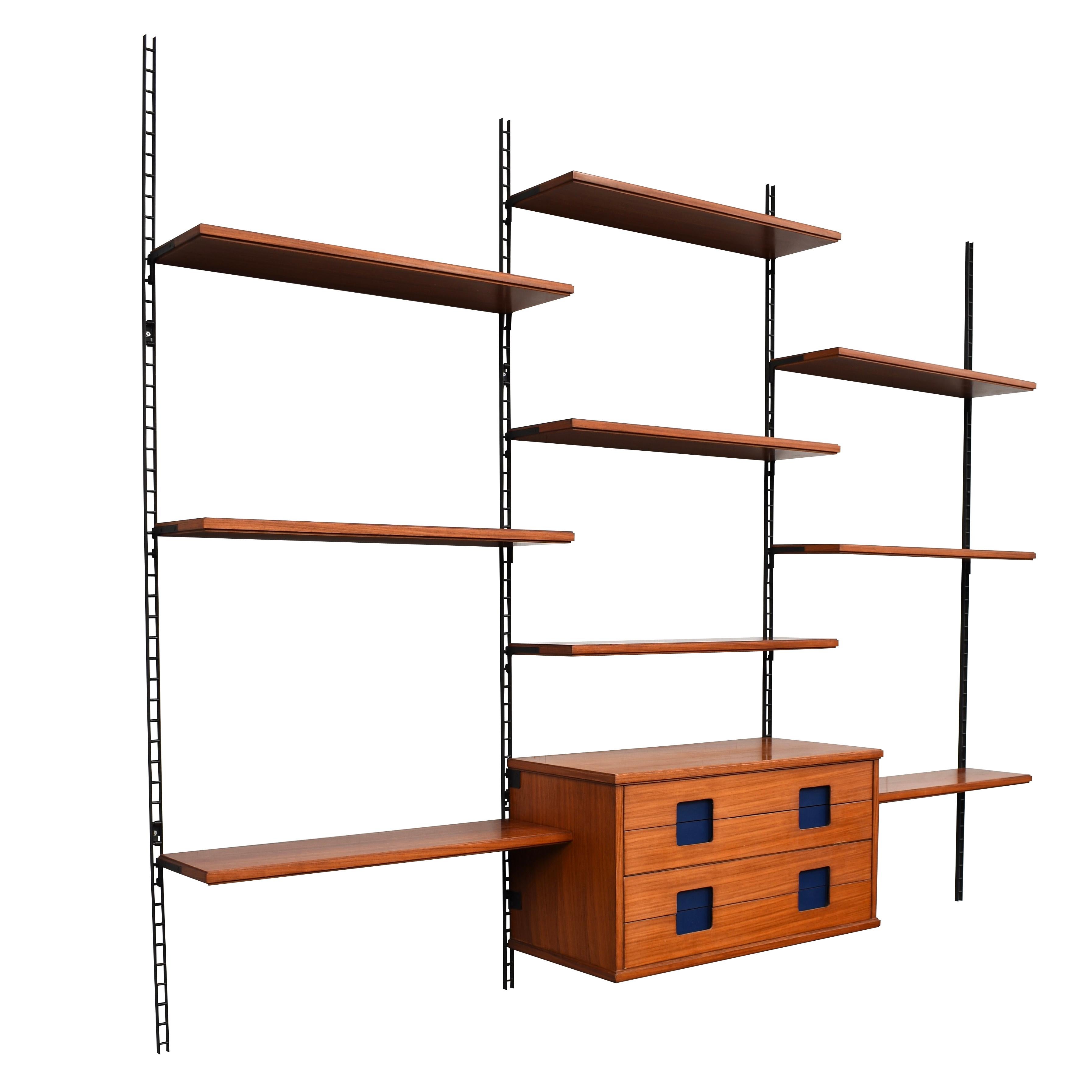 Italian wall unit in Brazilian rosewood and metal wall mounts, 1950s

The unit features beautiful dark blue grips.

Designer: unknown

Manufacturer: unknown

Country: Italy

Model: wall unit

Design period: 1950s

Date of
