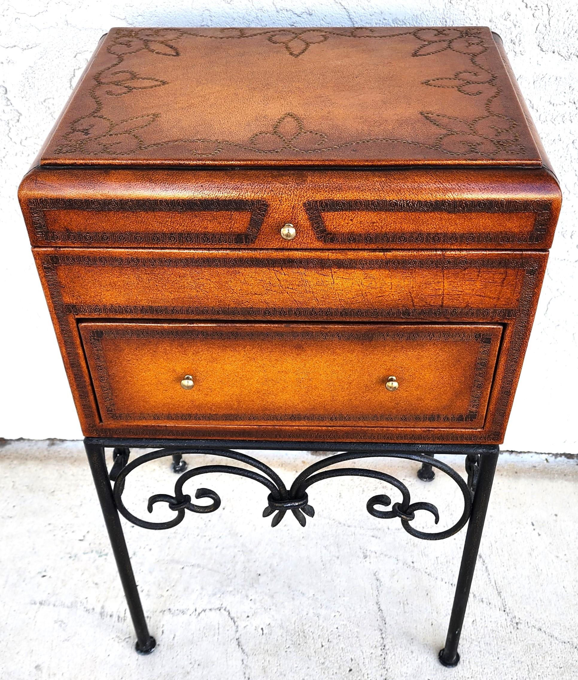 For FULL item description click on CONTINUE READING at the bottom of this page.

Offering One Of Our Recent Palm Beach Estate Fine Furniture Acquisitions Of A
Italian Tooled Leather Wrapped Flip-Top Box Table with Wrought Iron base, Brass Moriage