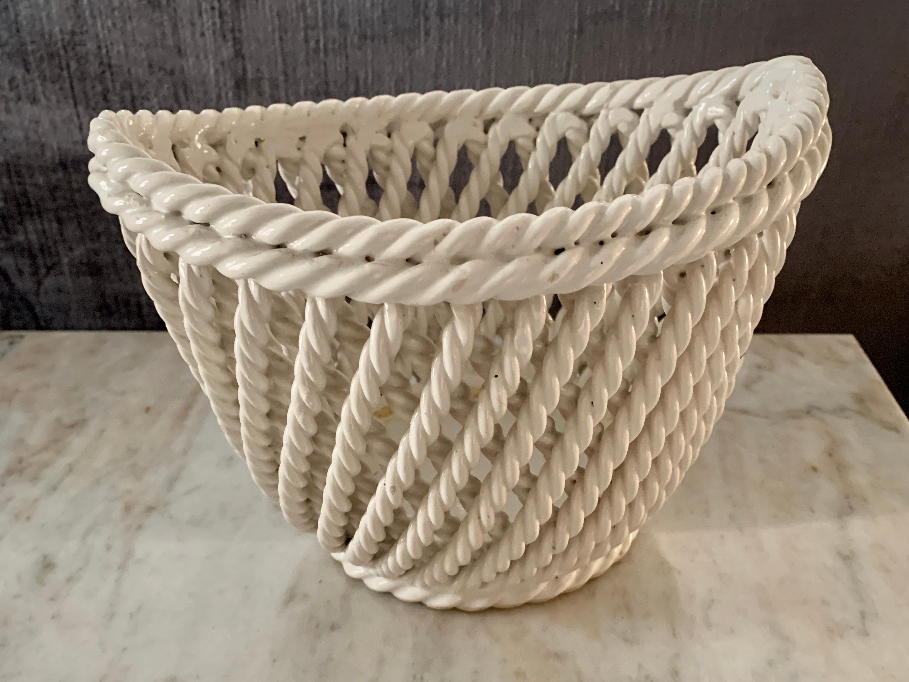 Elliptical braided lattice ceramic Italian bowl, perfectly suited to Stand alone hold candy and nuts to a flower arrangement or the side table, marked Italy on the bottom, no chips or condition issues.