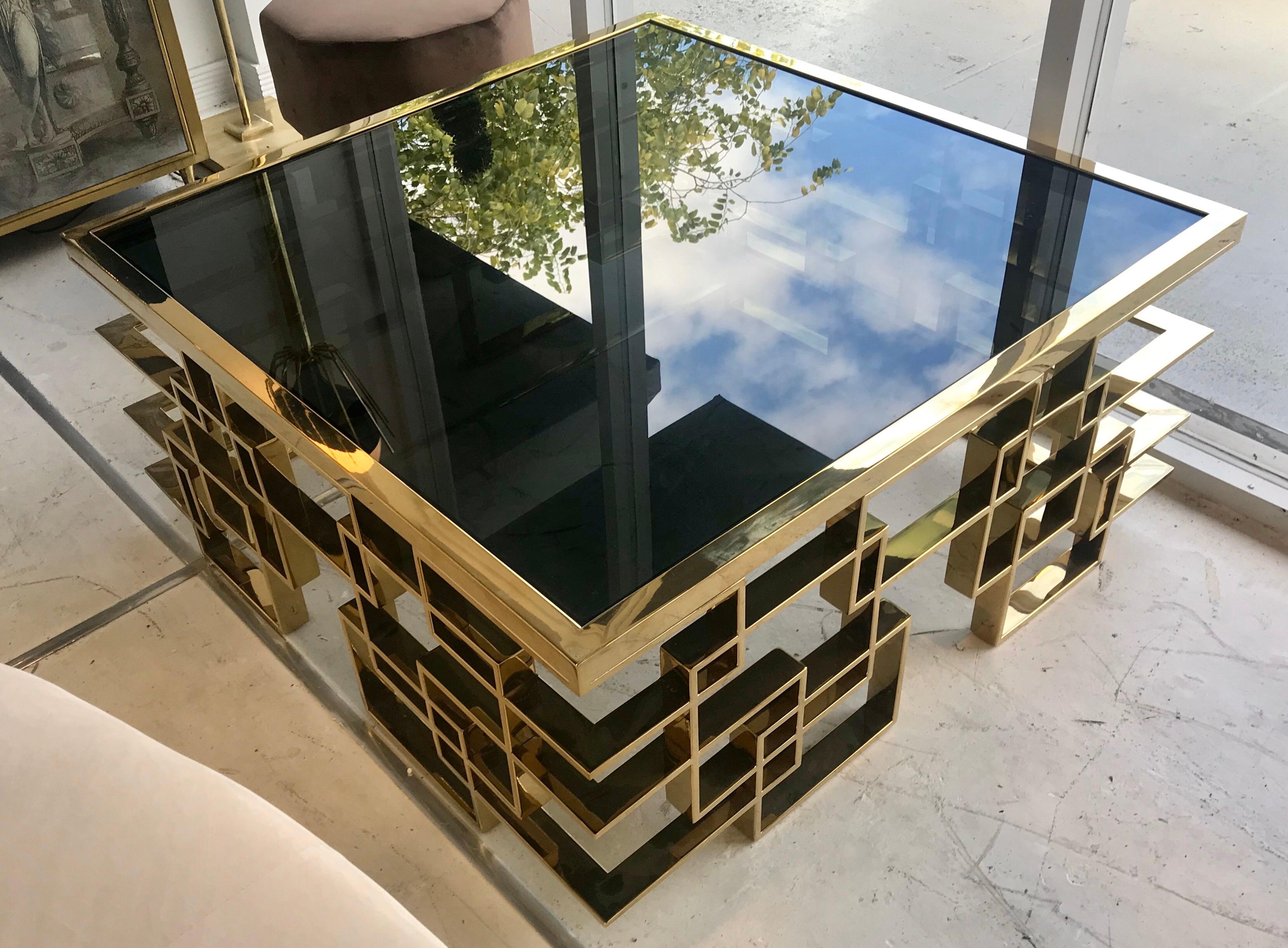 An Italian midcentury black glass and intricate glass cocktail table.