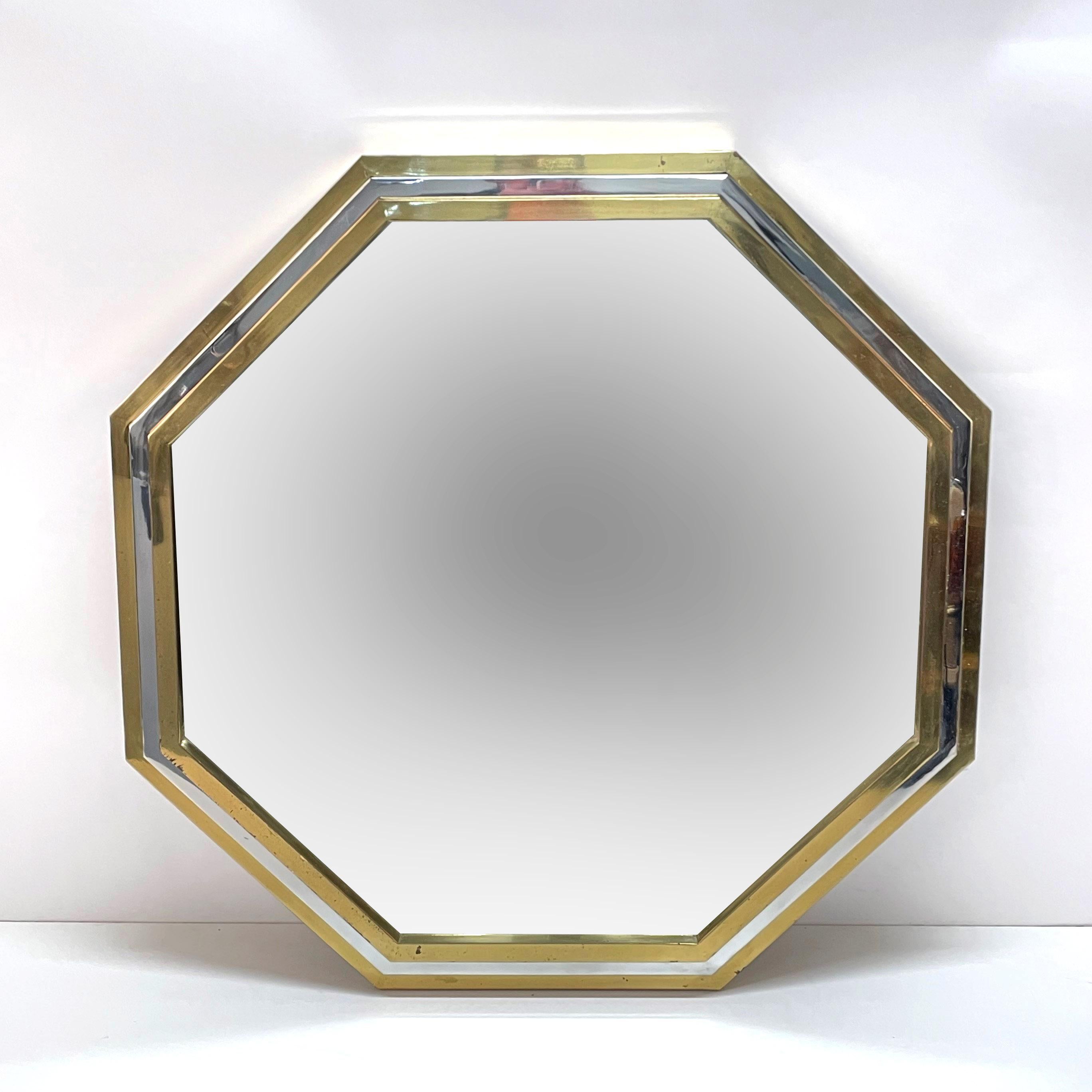 Magnificent and large midcentury octagonal mirror with brass and chromed brass frame. It was produced in Italy during 1970s and it is attributed to Willy Rizzo.

Its uniqueness is due to the wonderful triple-layer frame: it is made of two layers