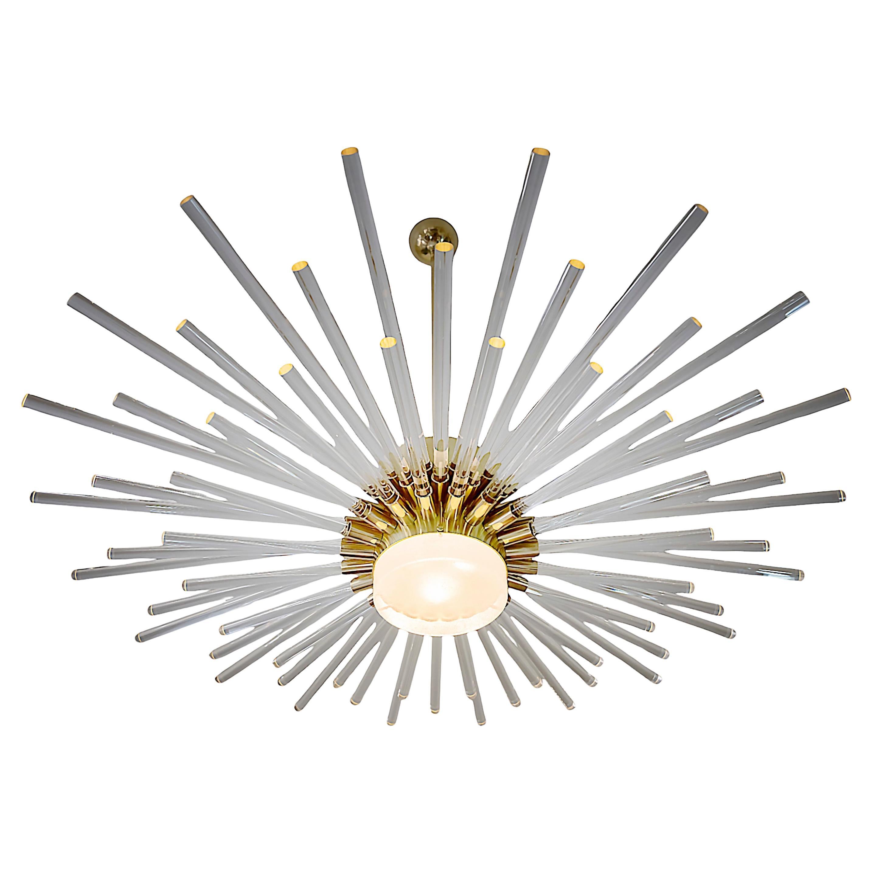 Italian hand made brass chandelier with clear solid glass in the holders and thick Murano glass element in the center.
This chandelier includes 3 pieces of E14 bulbs that spreads light through the glass details making impression of sunbeams. 
Very