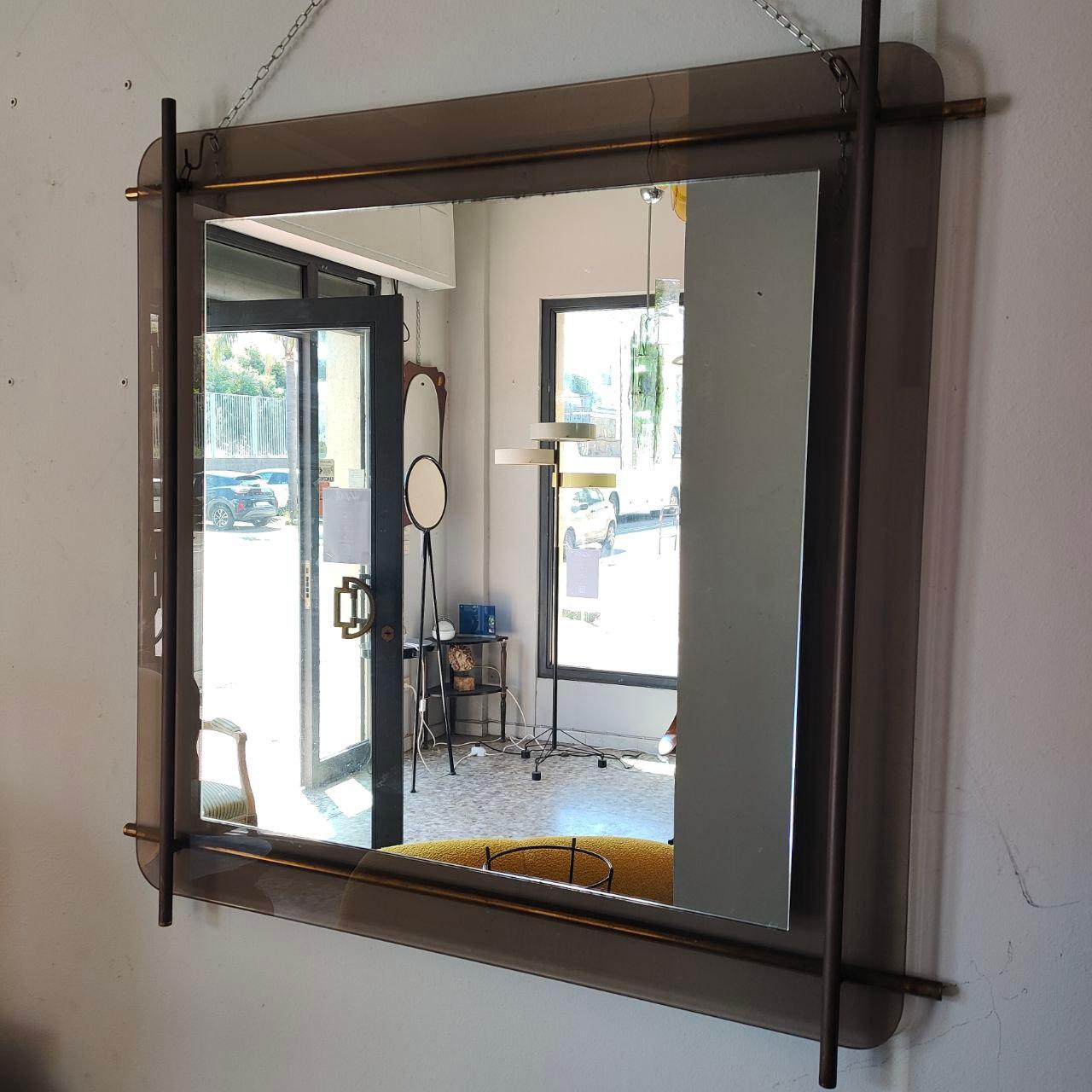 Italian brass and glass mirror by Renato Zevi for Metalarte, 1970s

Stunning square wall mirror designed by Renato Zevi, a noted figure in Italian modernism. This piece reflects Zevi's clean architectural approach, with an elegant brass frame
