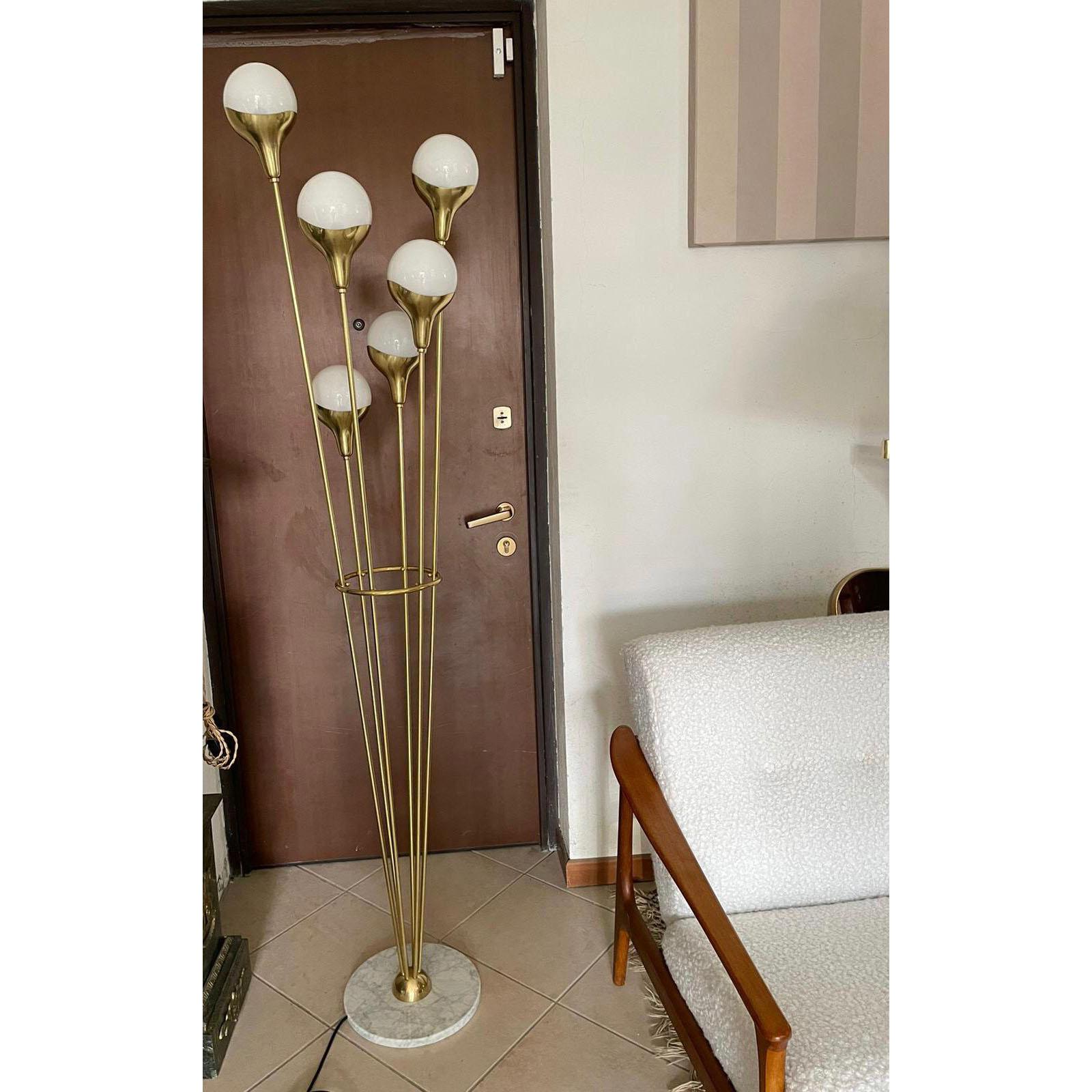 Floor lamp with six opaline shades, brass accents and marble base. 
In the style of Stilnovo, Italy. 
Dimensions. H 187 cm x Dm 46 cm. 
E14 standard delivery.
On request we can rewire it with E12 light bases for the US use.
Other customization