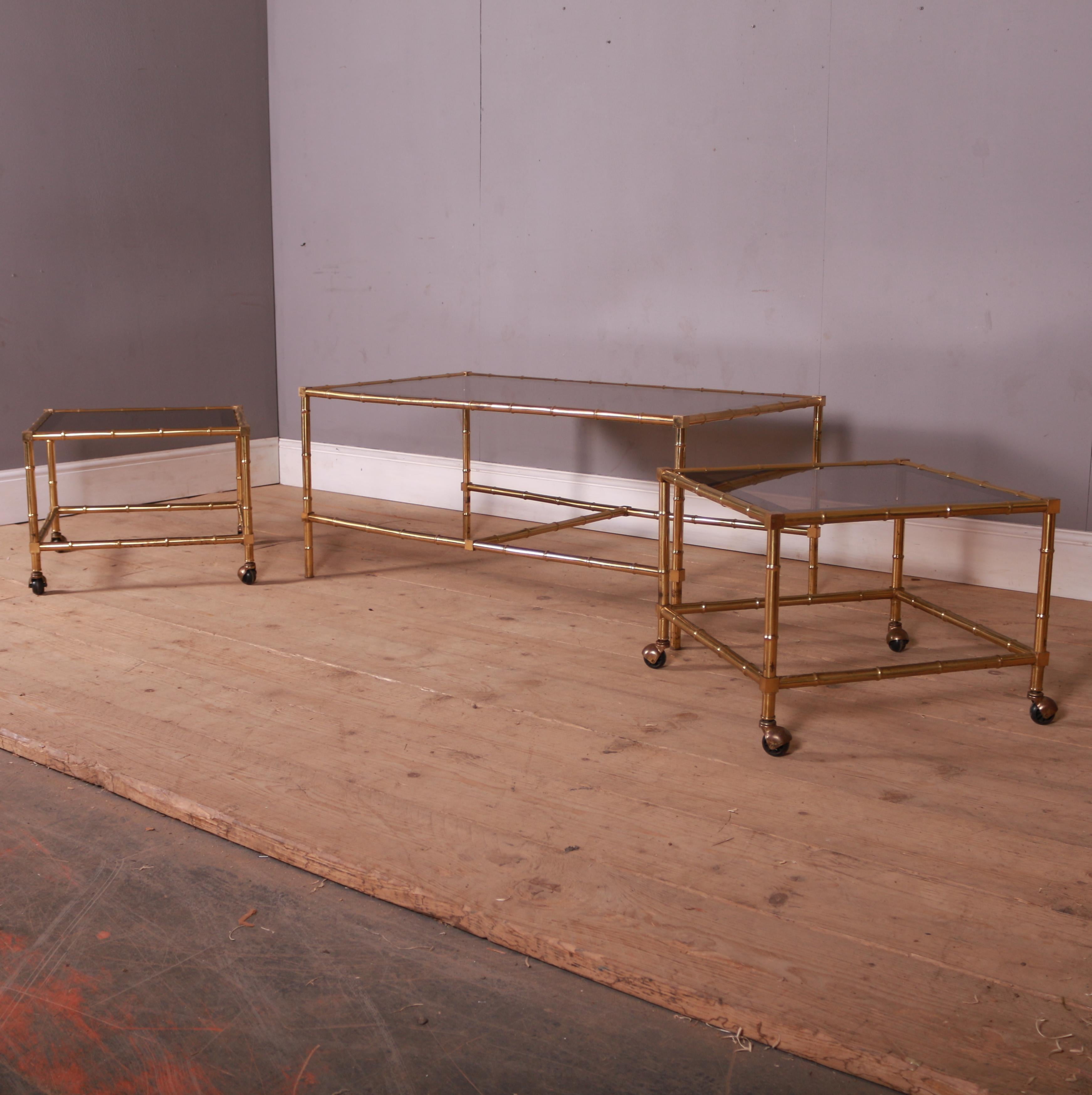 1970s Italian brass and glass faux bamboo coffee table with matching pair of side tables with the original tinted glass.

Tables are 22