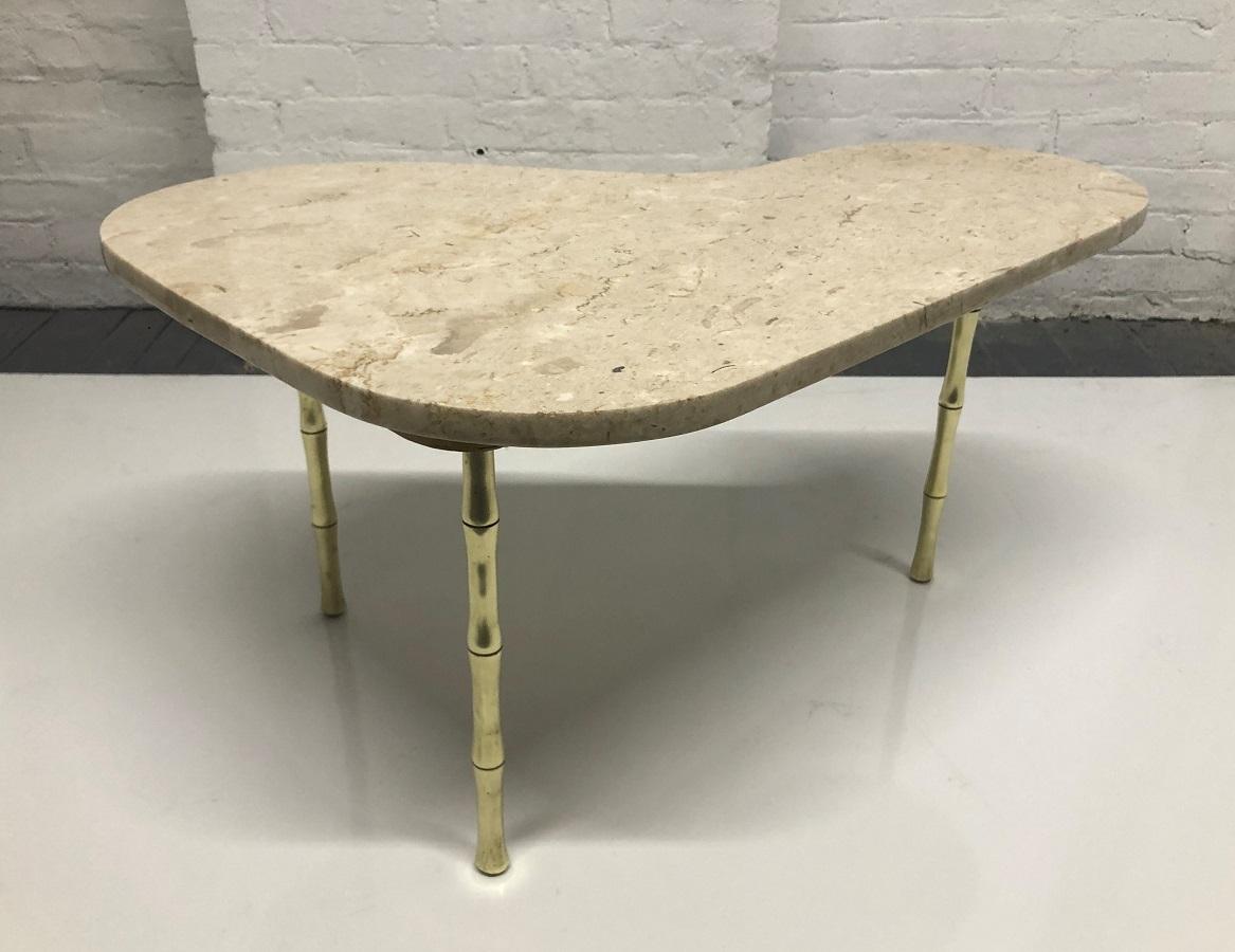Italian brass and marble-top boomerang shaped small coffee table. The table has faux bamboo brass legs.
   