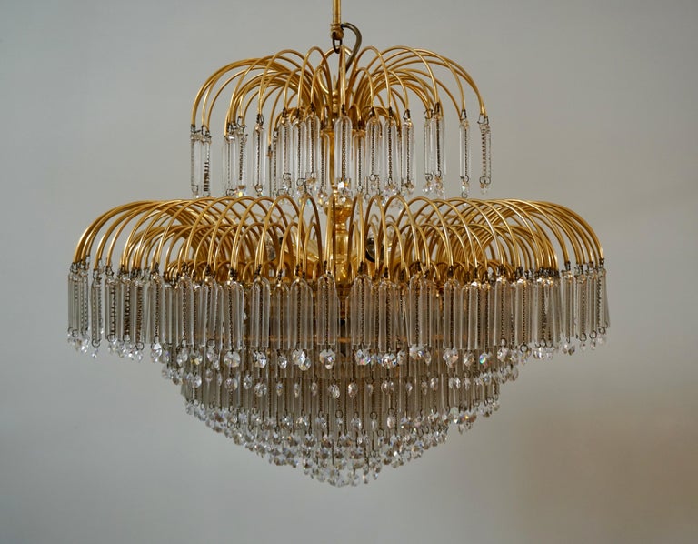 Rare beautiful Italian chandelier in brass decorated with Murano glass and crystal.

The light requires eight single E27 screw fit lightbulbs (60Watt max.) LED compatible.

Measures: Diameter:62 cm.
Height fixture 52 cm.
Total height 64