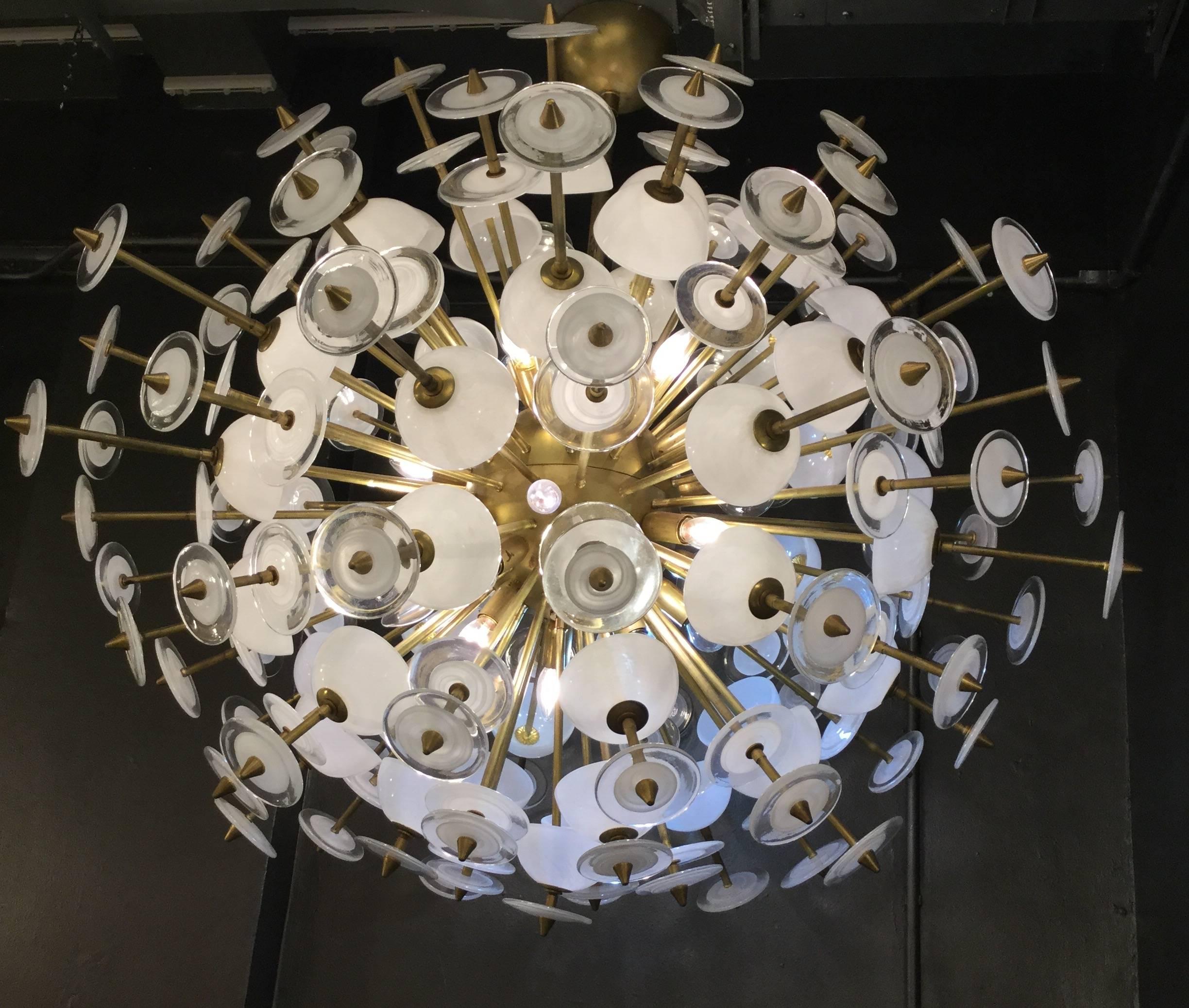  Monumental over sized Italian designed chandelier with white Murano glass elements  mounted on a brass fixture