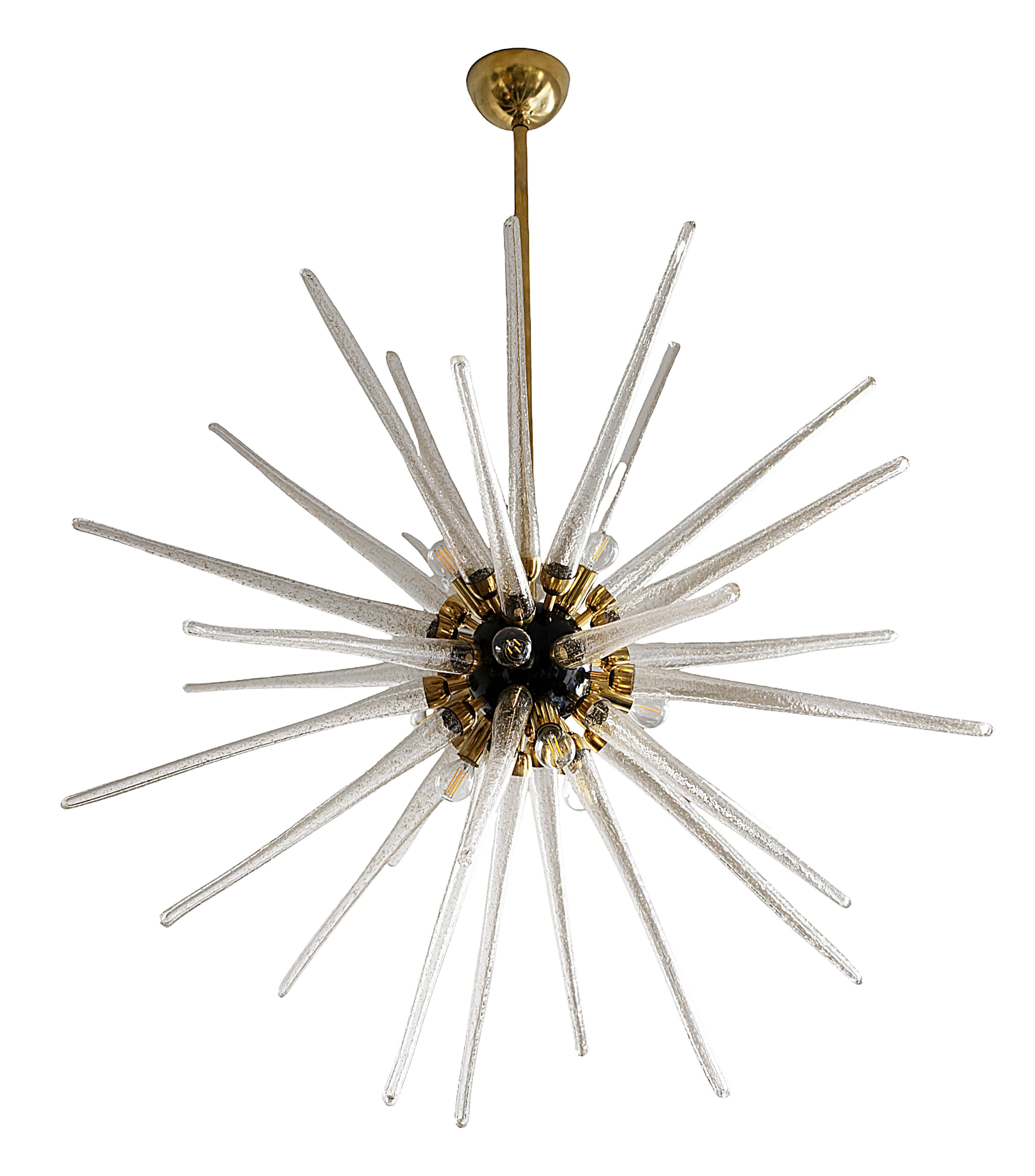Italian handmade Murano glass sputnik chandelier.
The base of this chandelier is in brass, central part in black paint, decorated with handmade solid Murano glass details in the form of ice icicle and gold dust inside.
This chandelier includes 12
