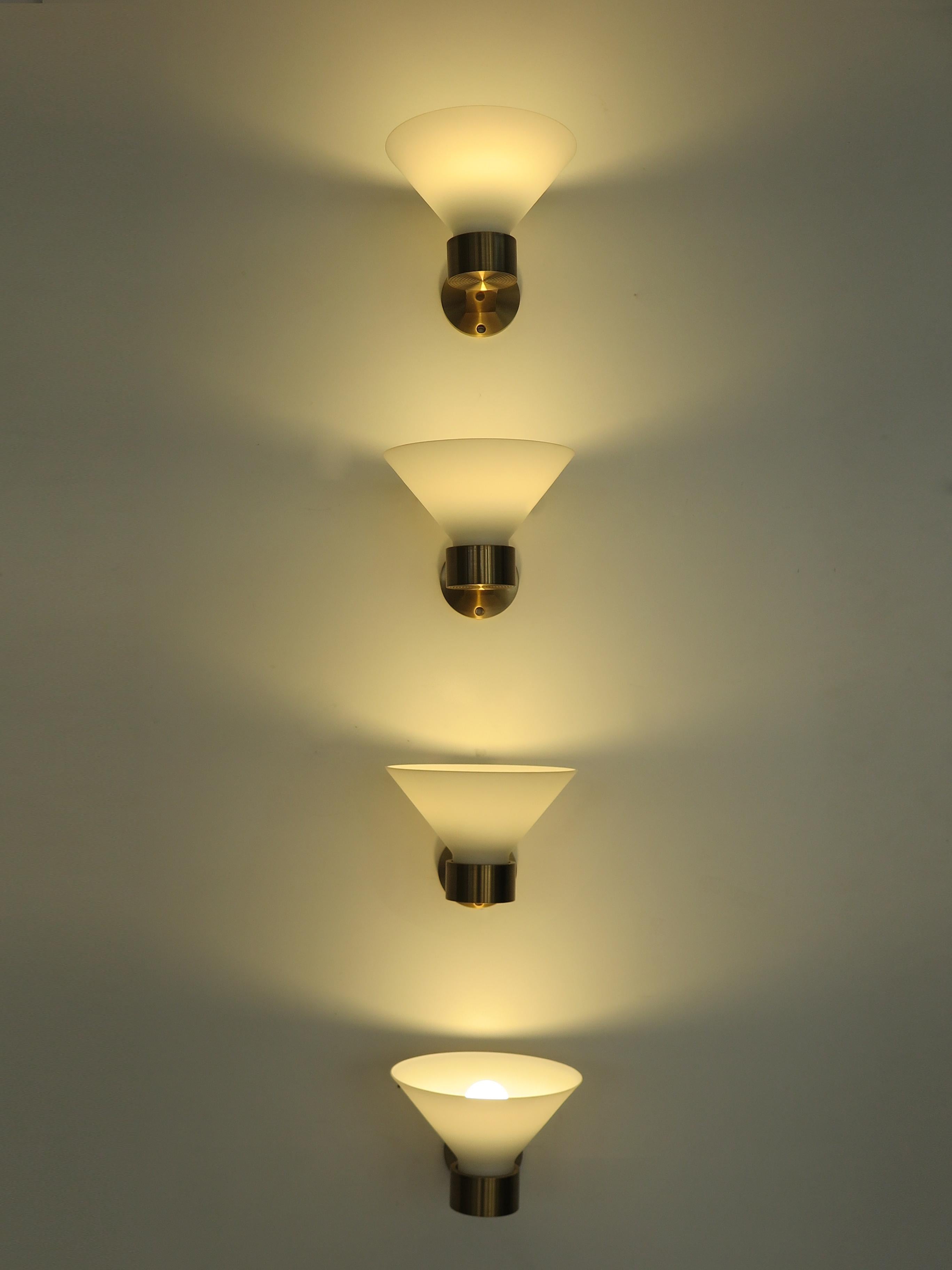 Set of four Italian wall sconces or wall lamps with solid brass frame and Murano glass lampshade, 1970s-1980s.