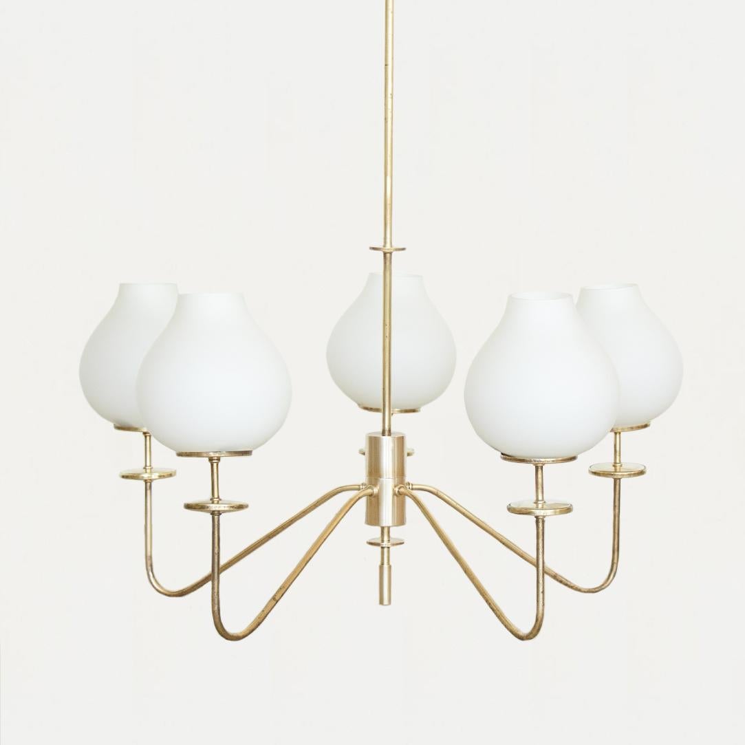Incredible brass and glass chandelier from Italy, 1940's. Five curved brass arms with bulbous white opaline glass shades. Nice patina on brass and all original glass. Beautiful statement piece. Overall height is 36.5
