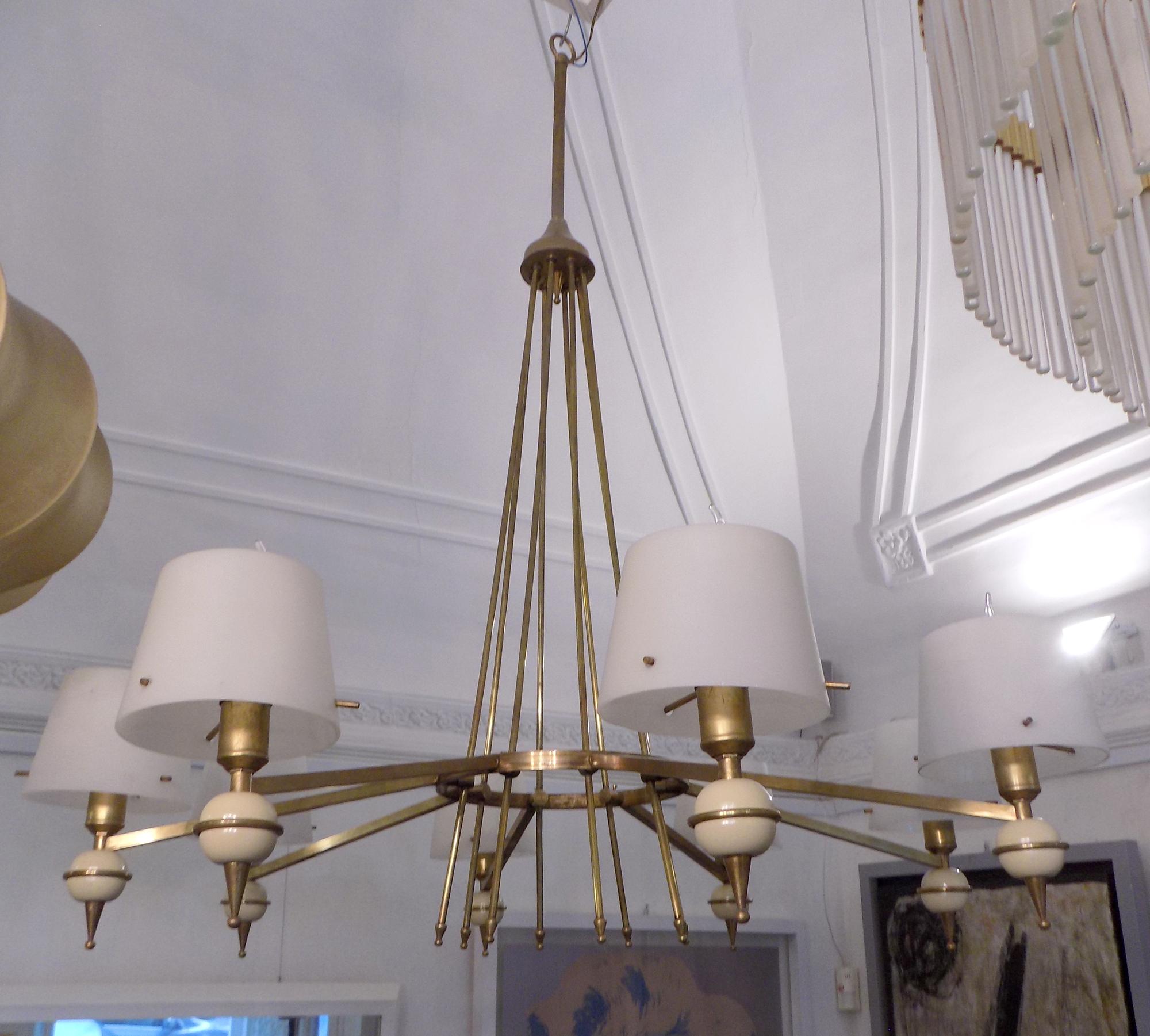 Stilnovo chandelier with eight brass arms and opaline glass shades.