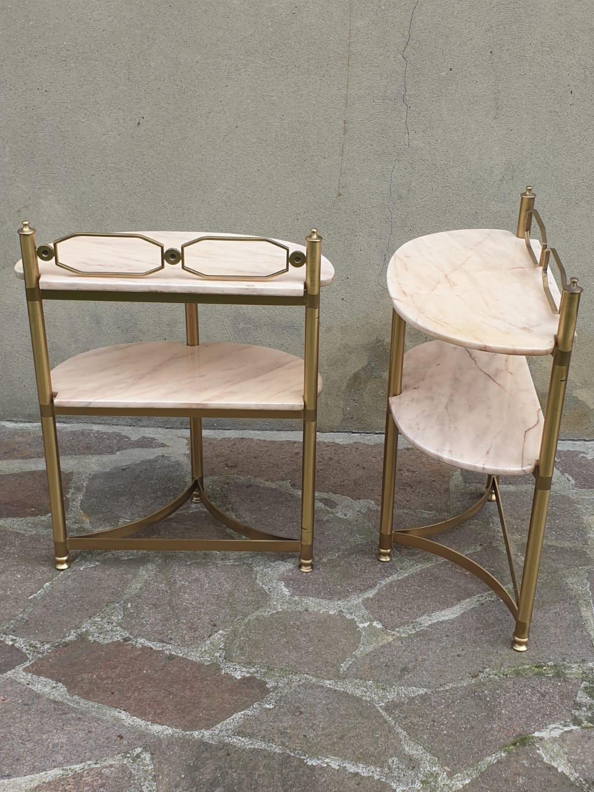Pair of demi-lune side tables or night stands.
Made in brass and Portuguese pink marble. Side tables are from the 1950 s period 
It might show slight traces of use since it's vintage, but it can be considered as in excellent original condition and