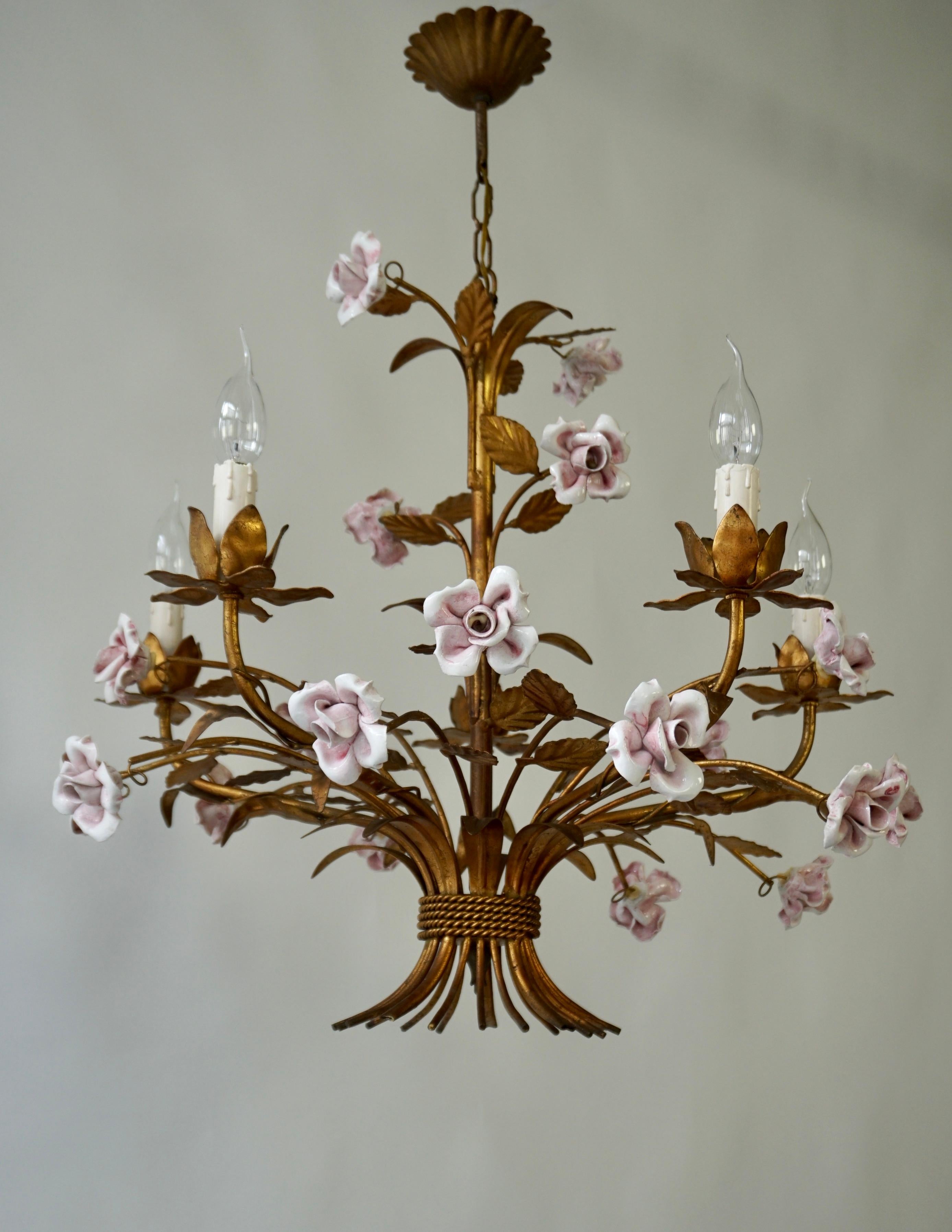 Large vintage, charming Italian hanging chandeliers, in brass with white pink ceramic handmade flower décor. An exquisite patinated bronzed antique gold gilt Tole chandelier with intricately hand crafted white pink porcelain roses. Wherever it is