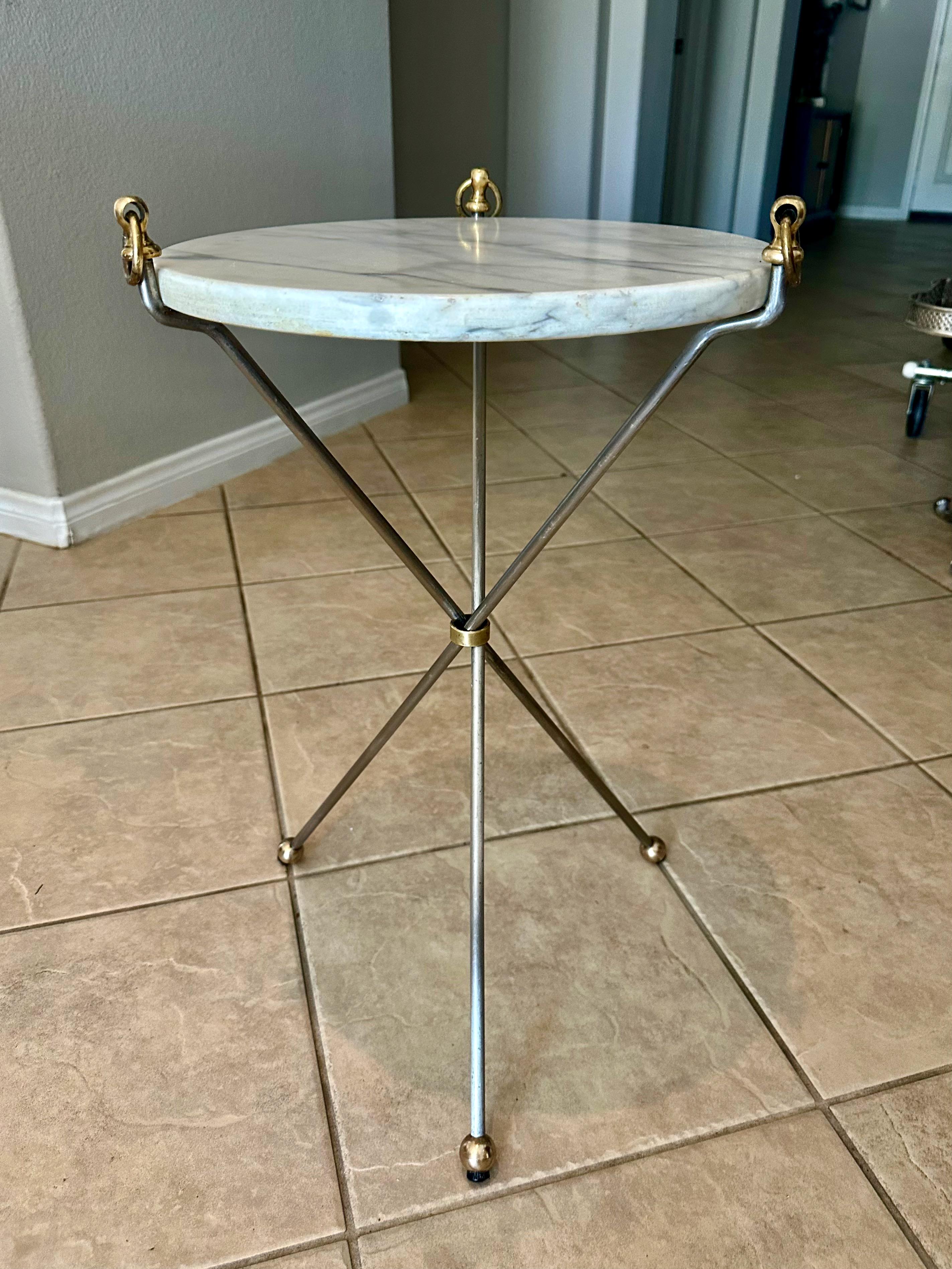 Italian tripod brass and steel side or end table with inset marble stone top.

 