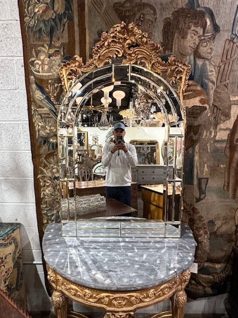 Vintage Italian polished brass arch mirror with beveled glass panels. Circa 1970. Perfect for today's transitional designs!