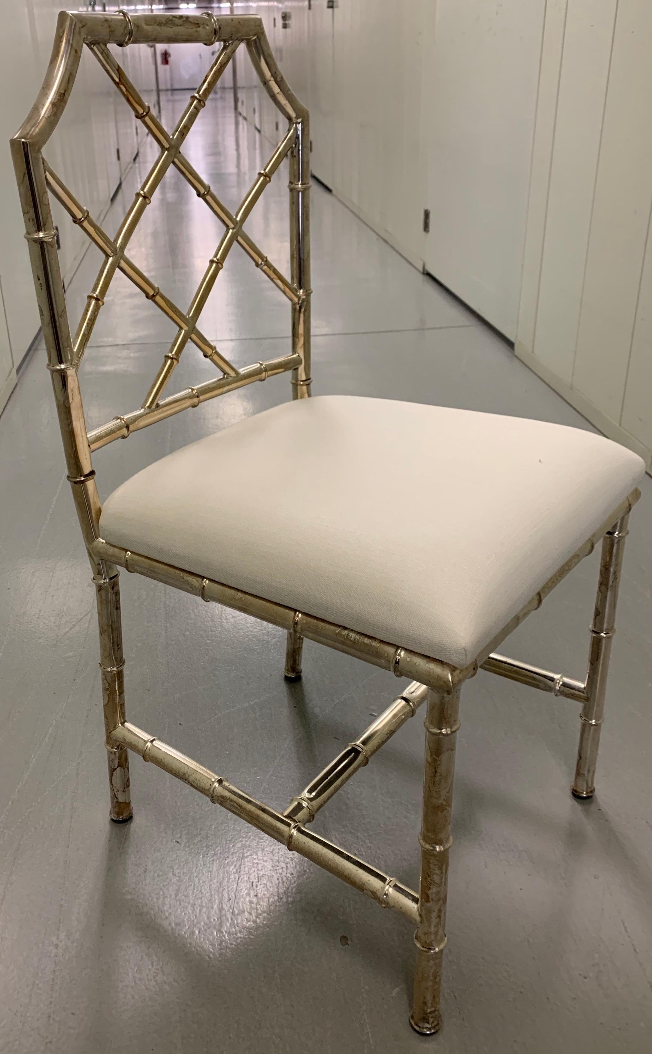 Italian brass bamboo side chair. Newly upholstered in white linen. Stamped made in Italy in the underside. Single chair perfect for a vanity, desk or as an accent chair. Fabric appears darker in photos. 