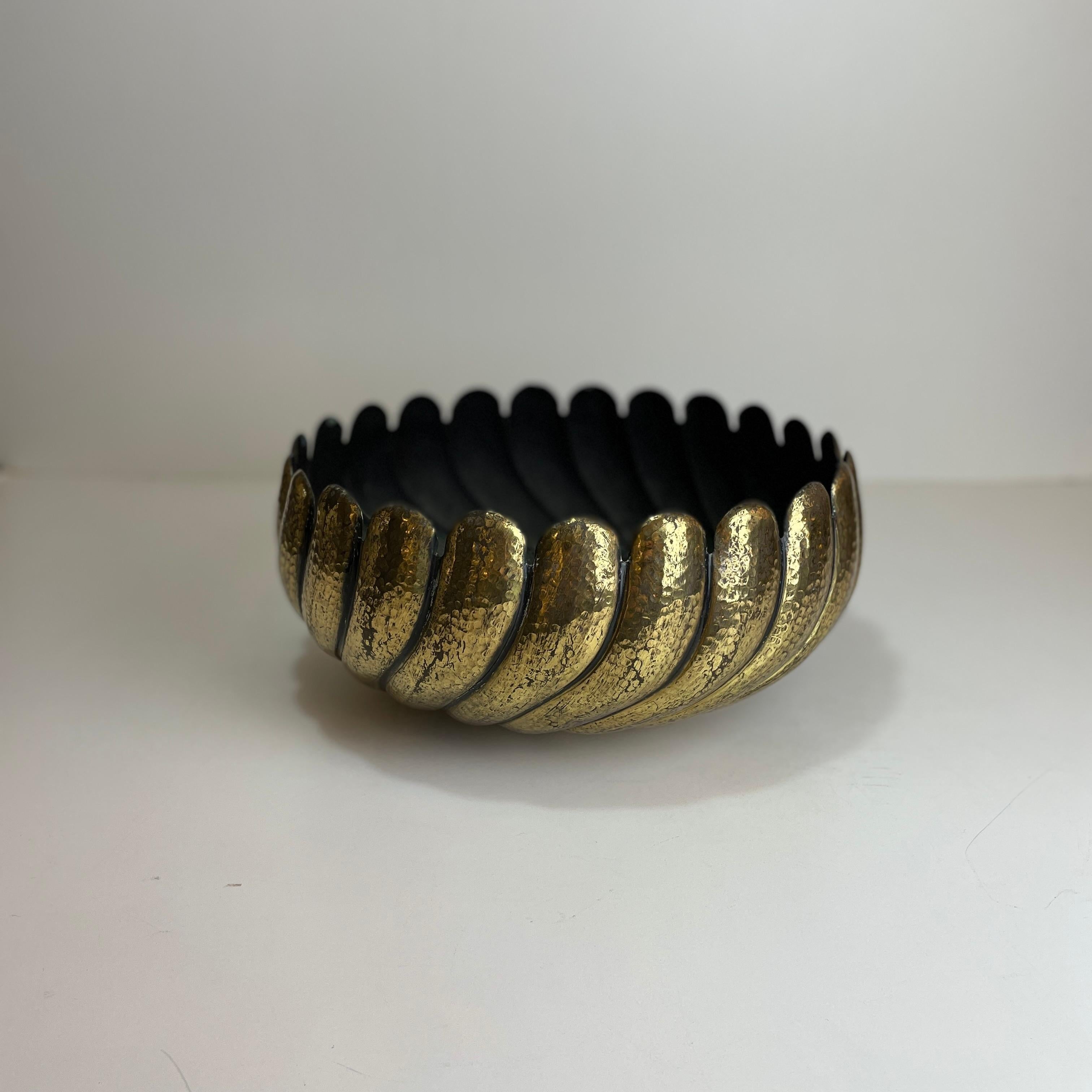 Large Italian bowl made in hammered brass in the style of Egidio Casagrande from the 1970’s.

Period : 1970's
Origin : Italy
Materials : brass
Color : gold
Dimensions : H 17cm x D 35cm
