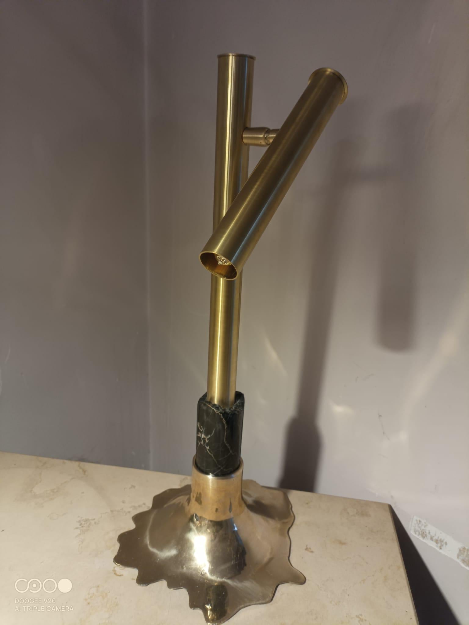 unique piece in limited edition, made with naturale polished marble Portoro from the cave in Porto Venere island, in cast brass basement that makes it impossible to copy, made in limited number with moveable lamp brass shade