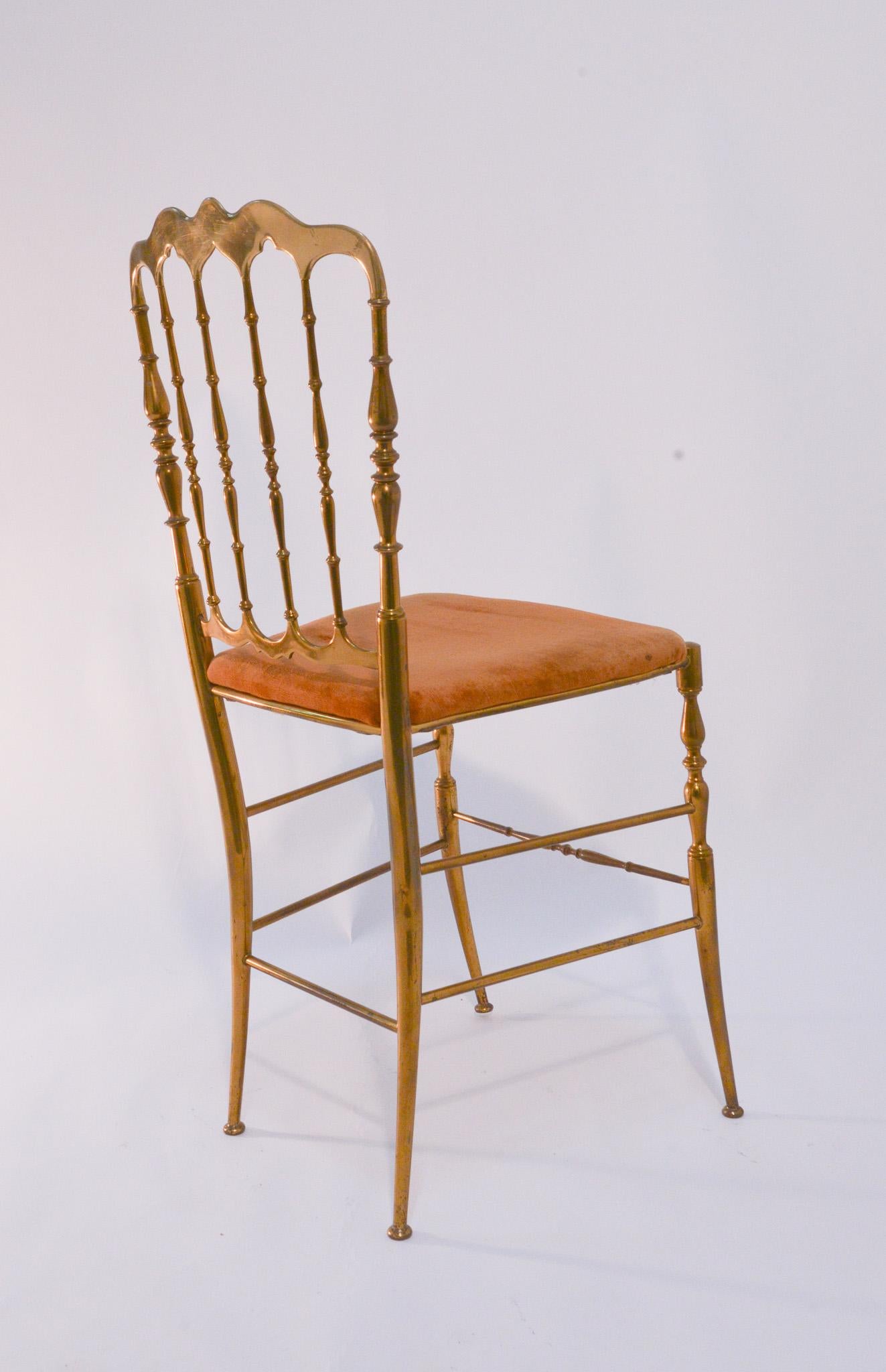 These Art Deco Italian Modernist dining chairs hold a delicate but impactful silhouette. Constructed by Chivari out of solid brass circa 1930, the six chairs show only light ware. Currently upholstered in a beautiful umber velvet, the seats can be