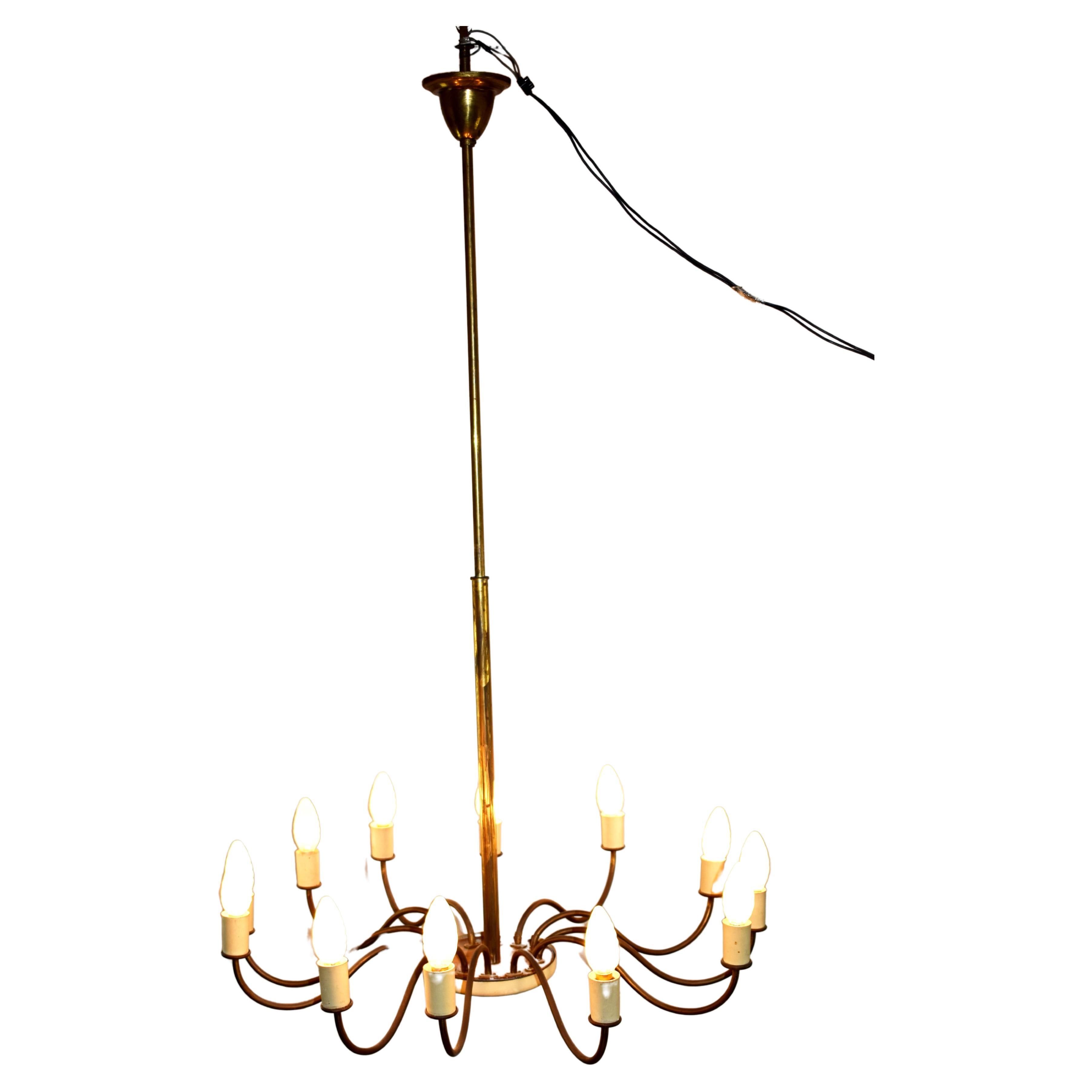Italian brass chandelier, 1950s.
Dimensions: H= 115 cm; D= 68 cm.