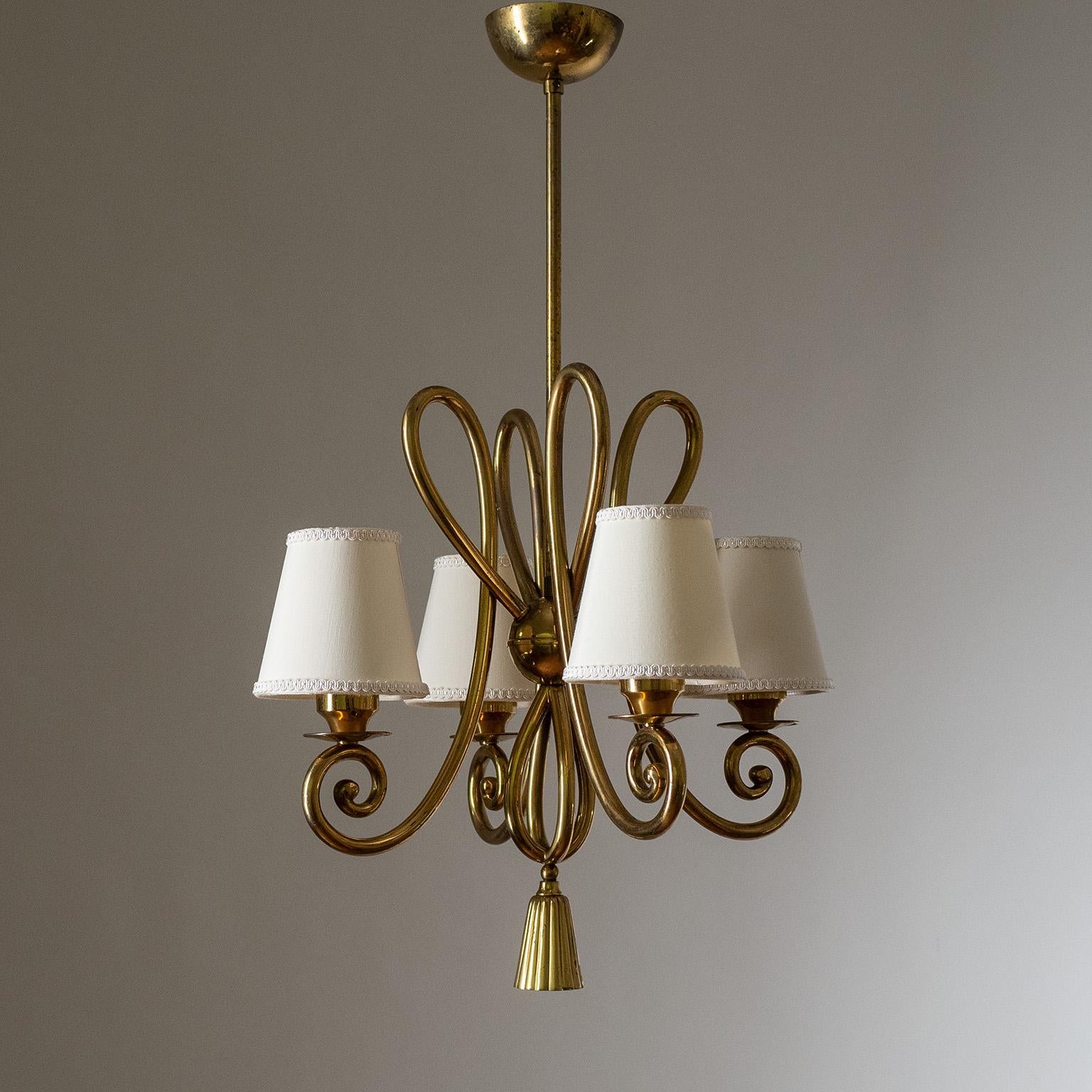 Charming Italian brass chandelier from the 1940-1950s. Four intricately curved brass arms, as well as a tassel-shaped brass finial. Four original brass E14 sockets with new wiring.