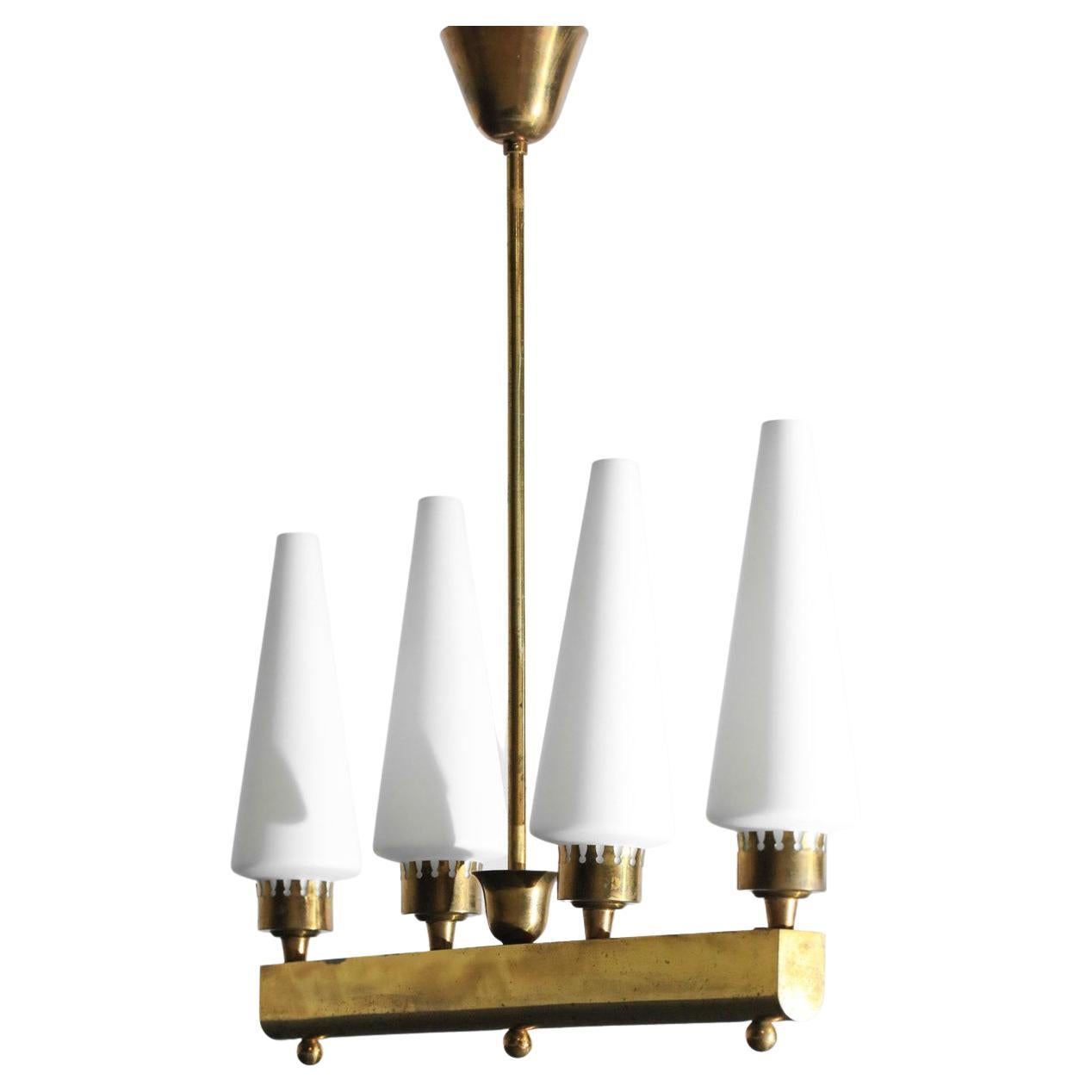 Italian chandelier from the '50s made by Steccari & Galli. Solid brass structure and conical diffusers in opaque white opaline. Pure, elegant lines. Very fine vintage condition (see photos). E14 LED bulbs recommended. 
Period: 50's